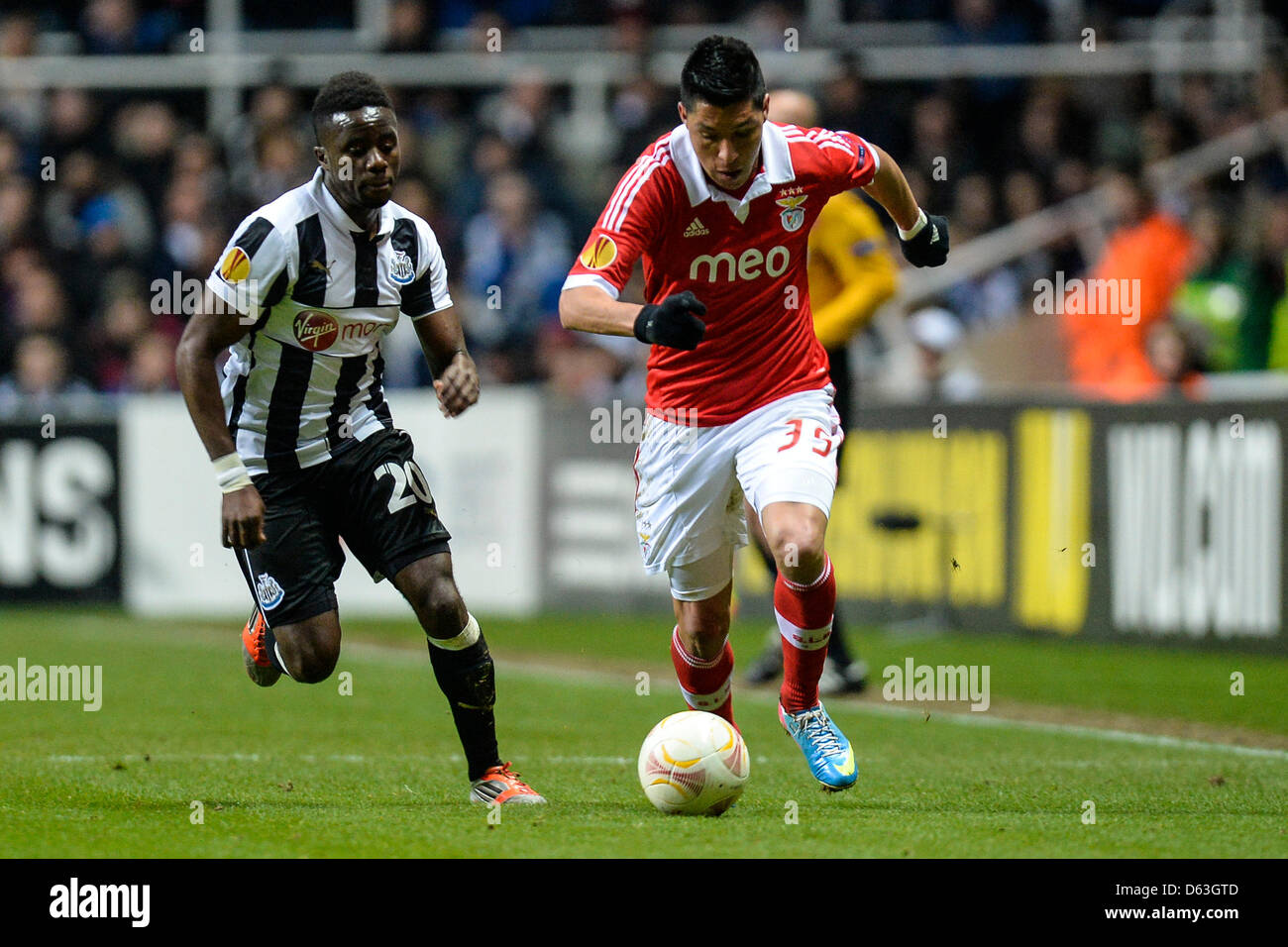 Newcastle, UK. 11th April 2013. Gael Bigirimana chases down Enzo Perez during the Europa League 2nd leg game between Newcastle and Benfica from St James Park. Credit: Action Plus Sports Images / Alamy Live News Stock Photo