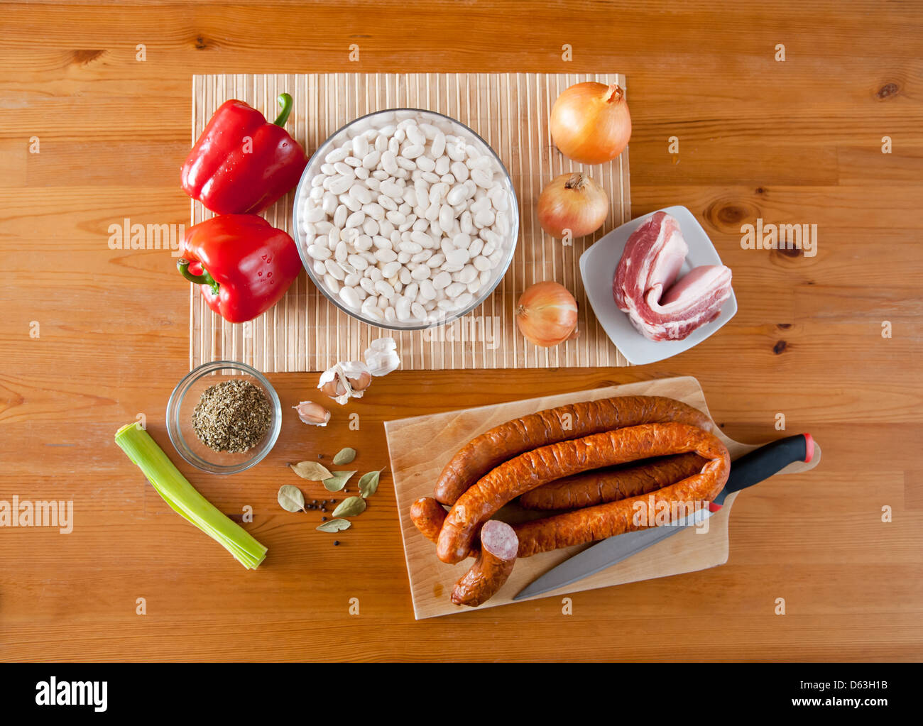 Bean seeds soak and sausage with vegetables Stock Photo