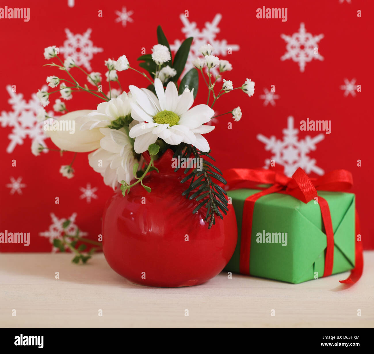 Bouquet of winter flowers with present Stock Photo Alamy