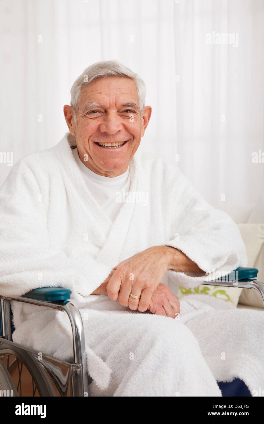 Smiling senior man on wheelchair Stock Photo