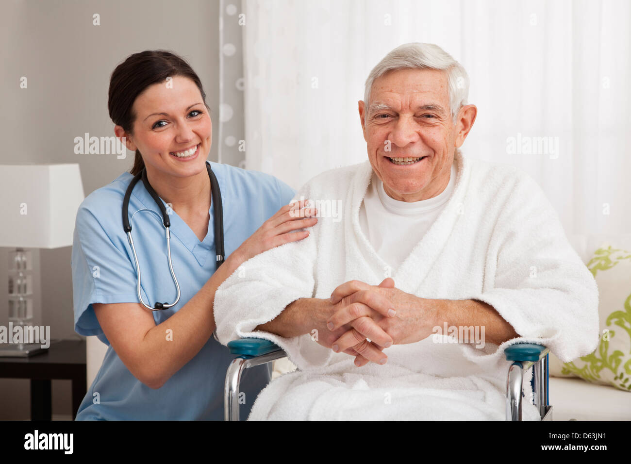 Portrait of nurse with senior patient smiling Stock Photo