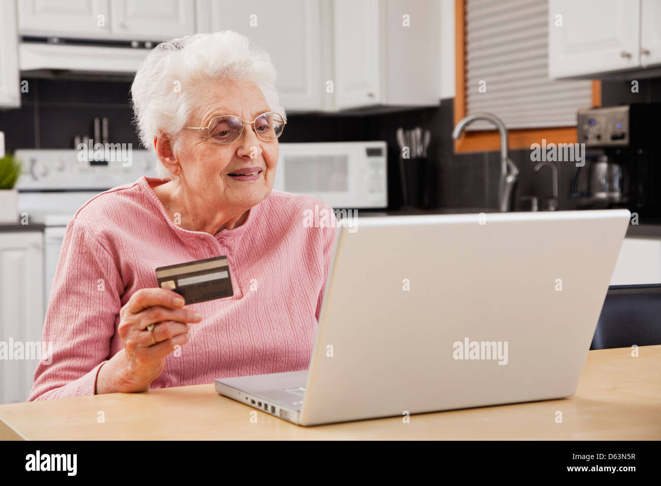 Senior woman shopping online Stock Photo