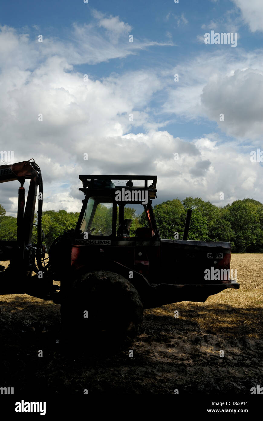 Heavy machinery, Kockums tractor silhouetted against lighter background on farmland in Kent, England, Britain, UK, Stock Photo