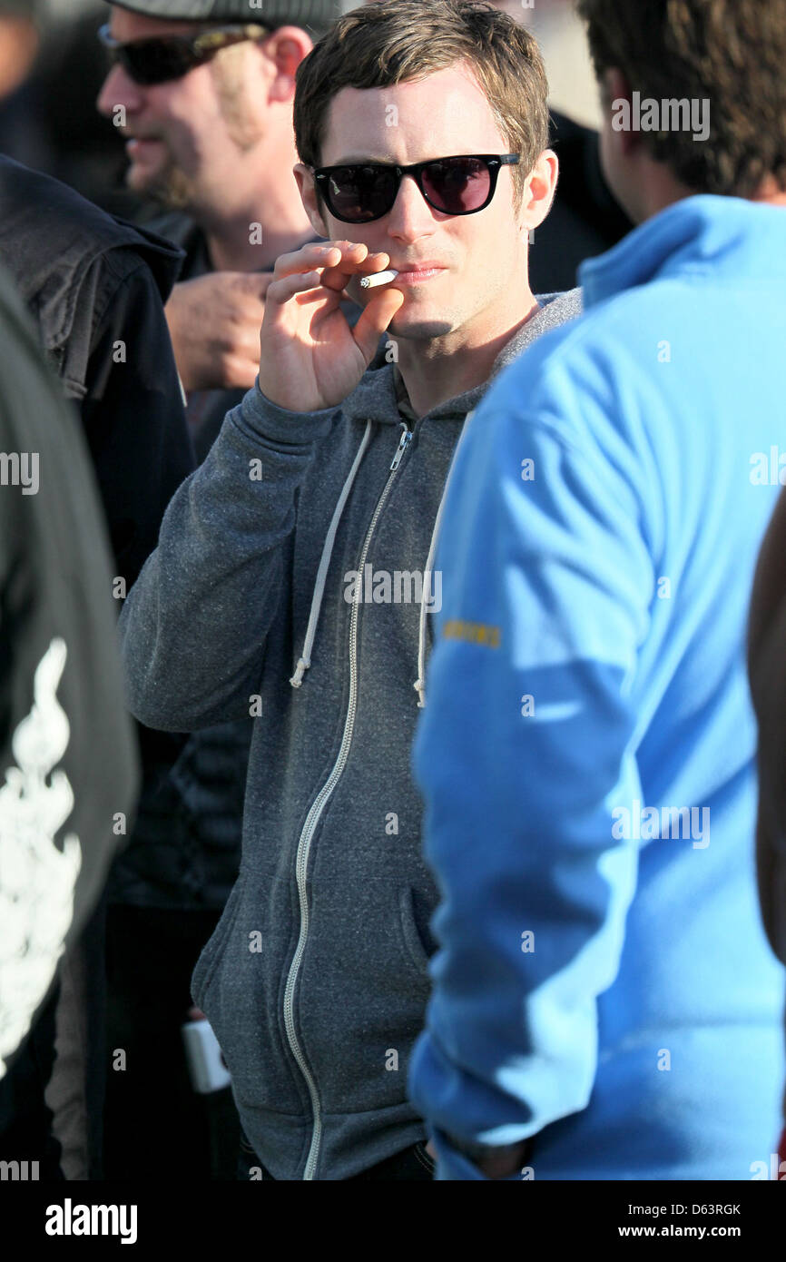 Elijah Wood smoking on the set of his new television project 'Wilfred' Los  Angeles, California - 28.03.11 Stock Photo - Alamy