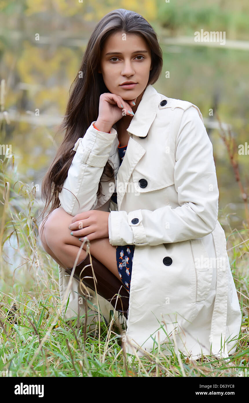 Beautiful young girl in autumn park Stock Photo - Alamy
