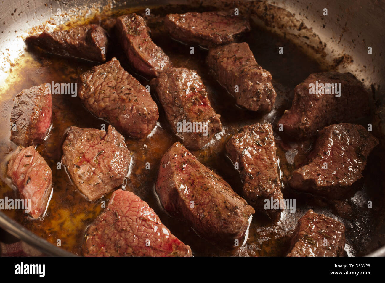 beef browning in a pan Stock Photo