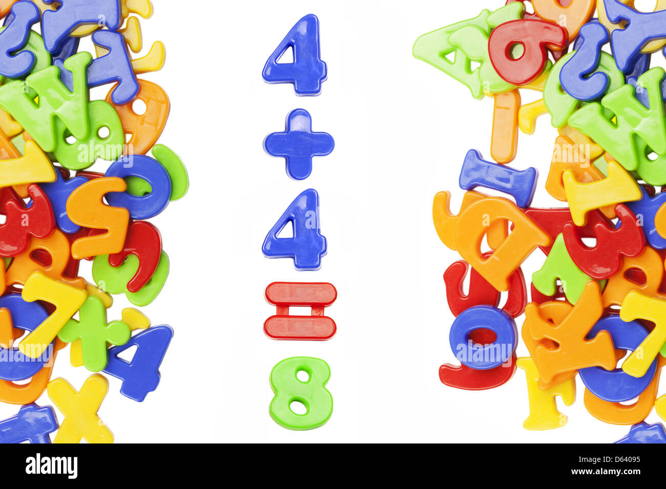 Plastic figures near plastic alphabet letters Stock Photo