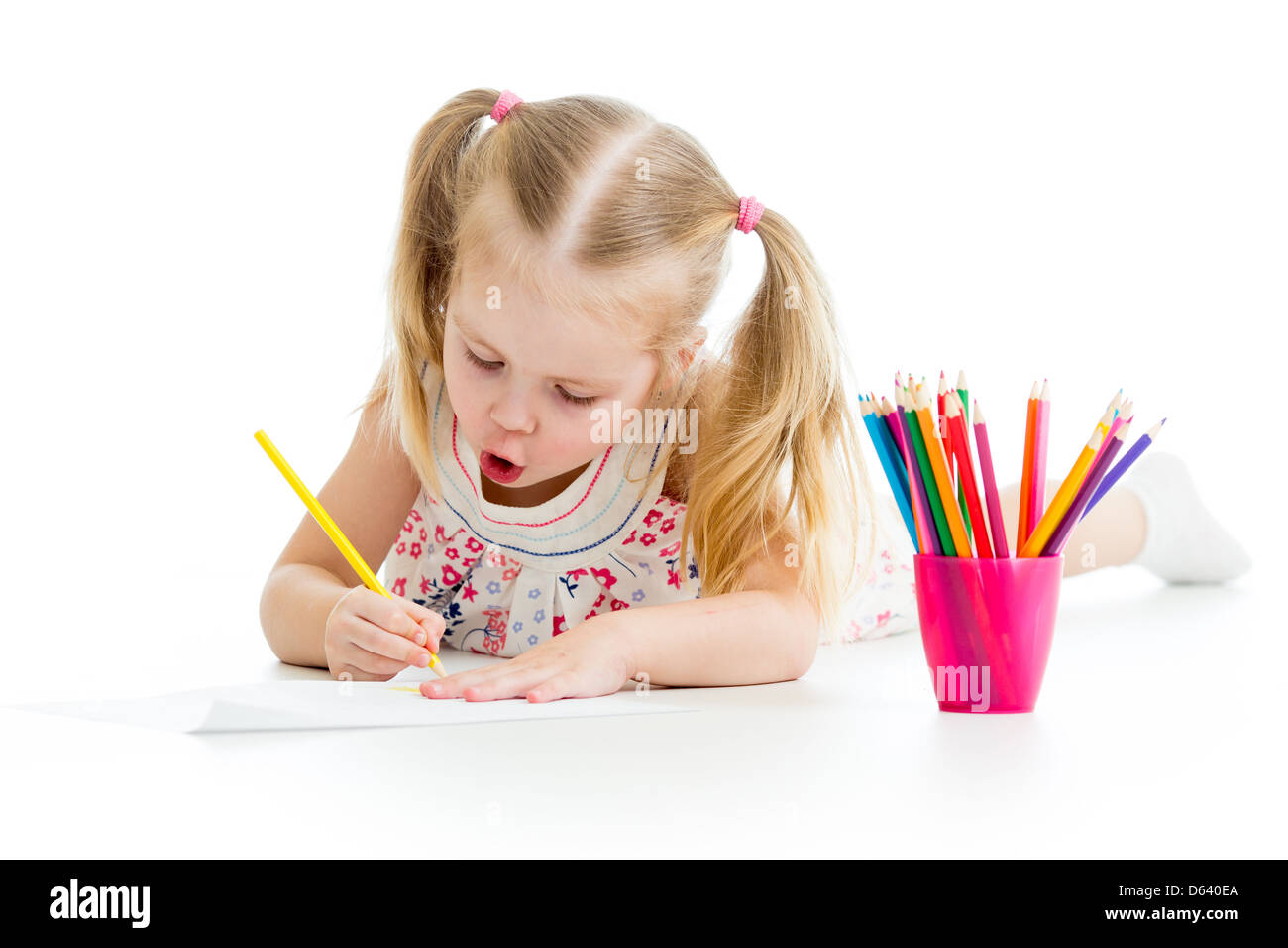 kid girl drawing with colourful pencils Stock Photo