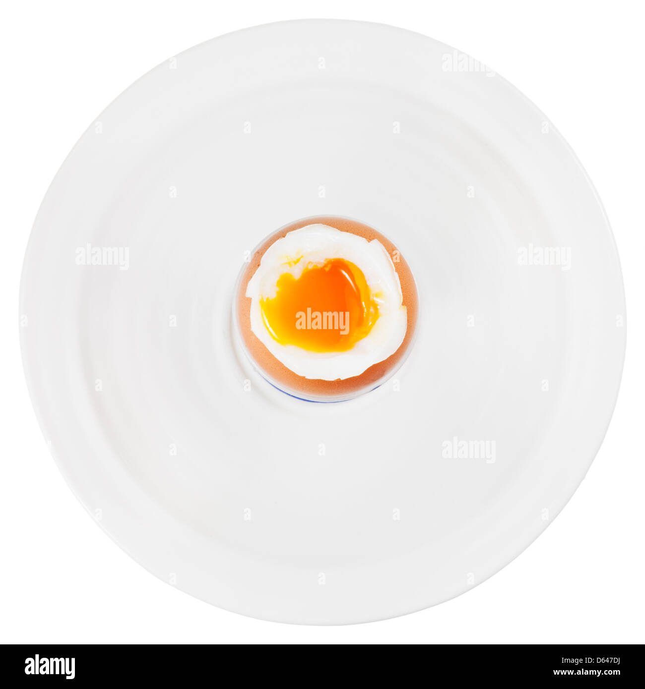 top view of soft boiled egg in egg cup on white plate isolated on white Stock Photo