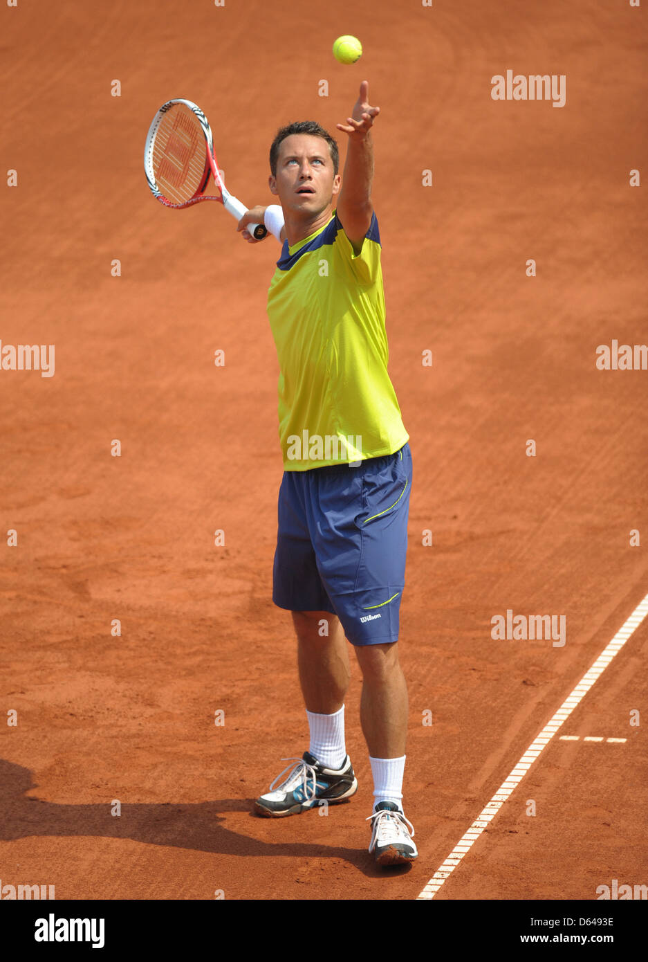 German tennis pro Philipp Kohlschreiber serves the ball against Croatia's Zovko during the Tennis World Team Cup match between Germany and Croatia at the Rochusclub in Duesseldorf, Germany, 23 May 2012.   Photo: Caroline Seidel Stock Photo