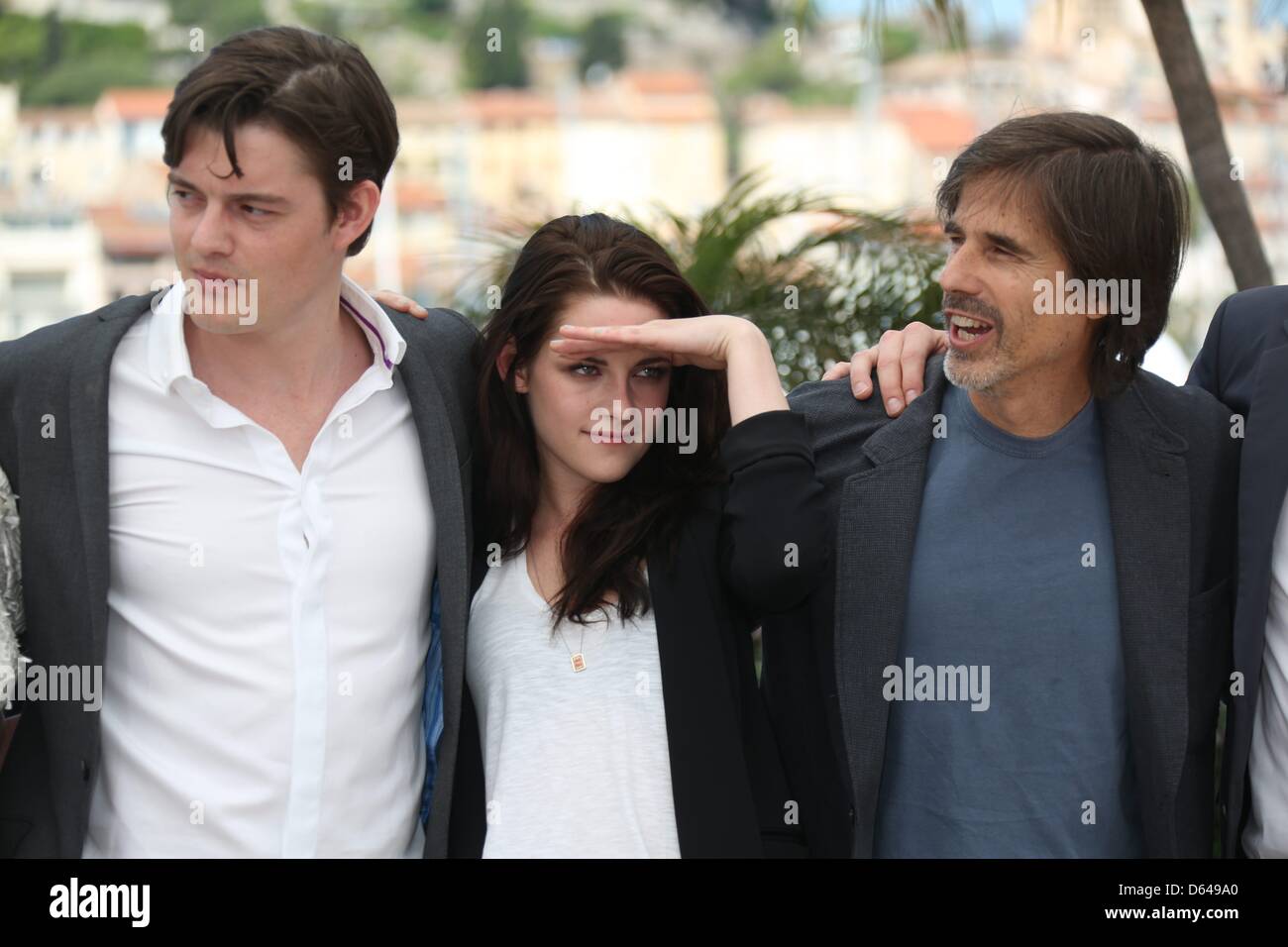 Actor Sam Riley, director Walter Salles and actress Kristen Stewart pose at the photocall of 'On The Road' during the 65th Cannes Film Festival at Palais des Festivals in Cannes, France, on 23 May 2012. Photo: Hubert Boesl Stock Photo