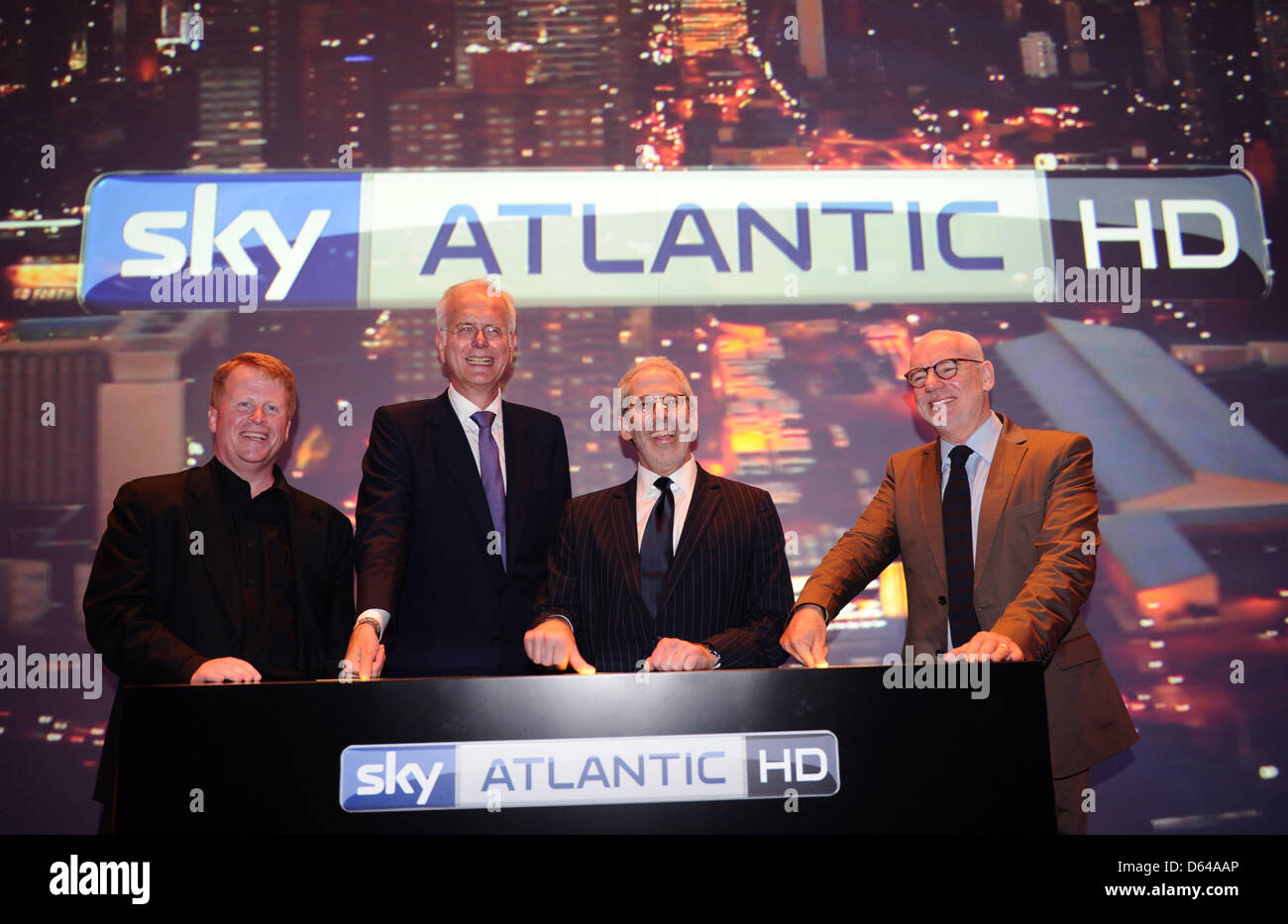 (L-R) Brian Sullivan, CEO Sky Deutschland, Entertainer moderator Harald Schmidt, Charles Schreger, HBO New York, und Gary Davey and Gary Davey, head of program at Sky Germany attend the presentation of the new pay tv platform Sky Atlantic HD in Hamburg, Germany, 23 May 2012. The new HD channel brings the US channel HBO to Germany. Photo: Christian Charisius Stock Photo
