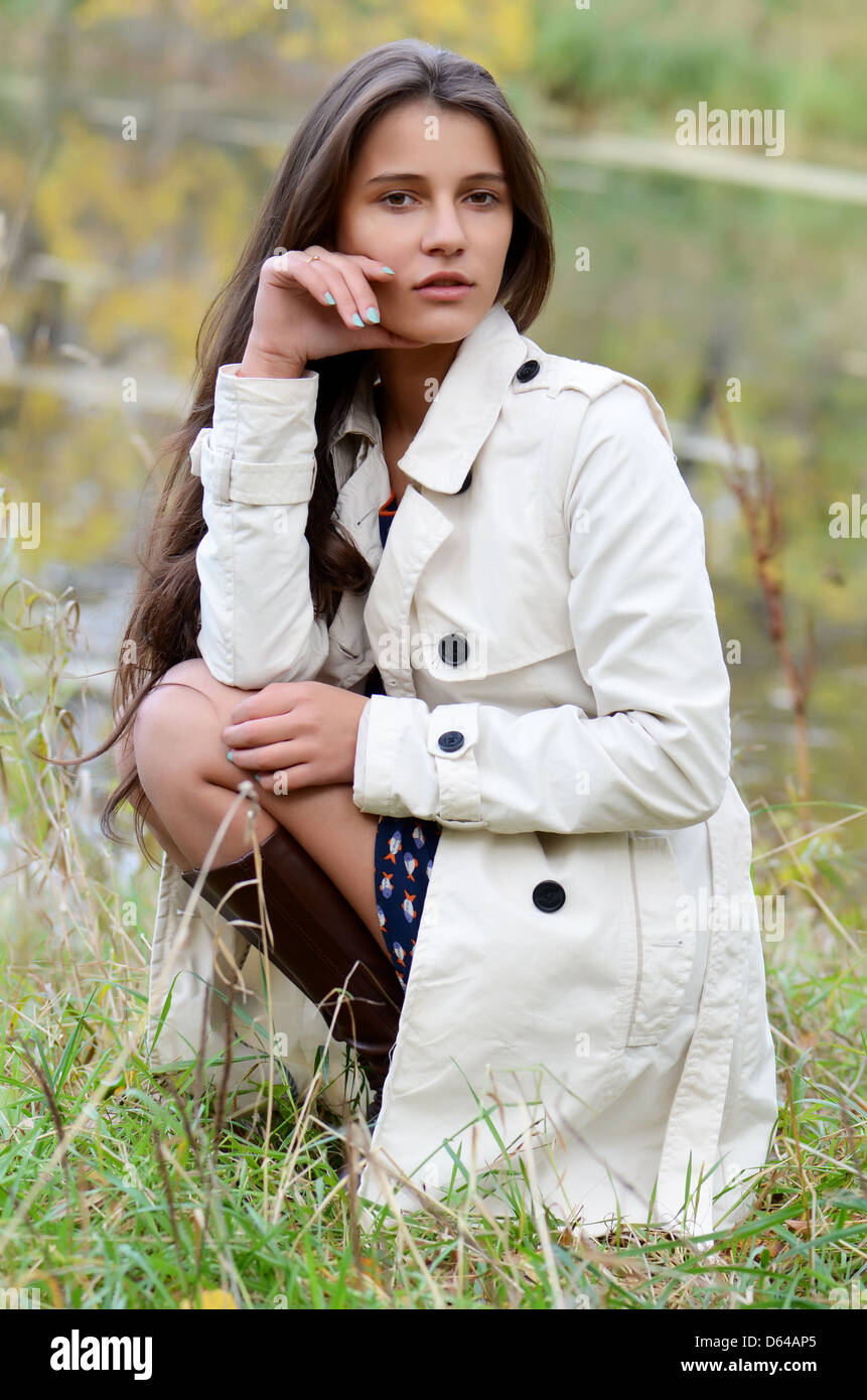 Beautiful young girl in autumn park Stock Photo - Alamy