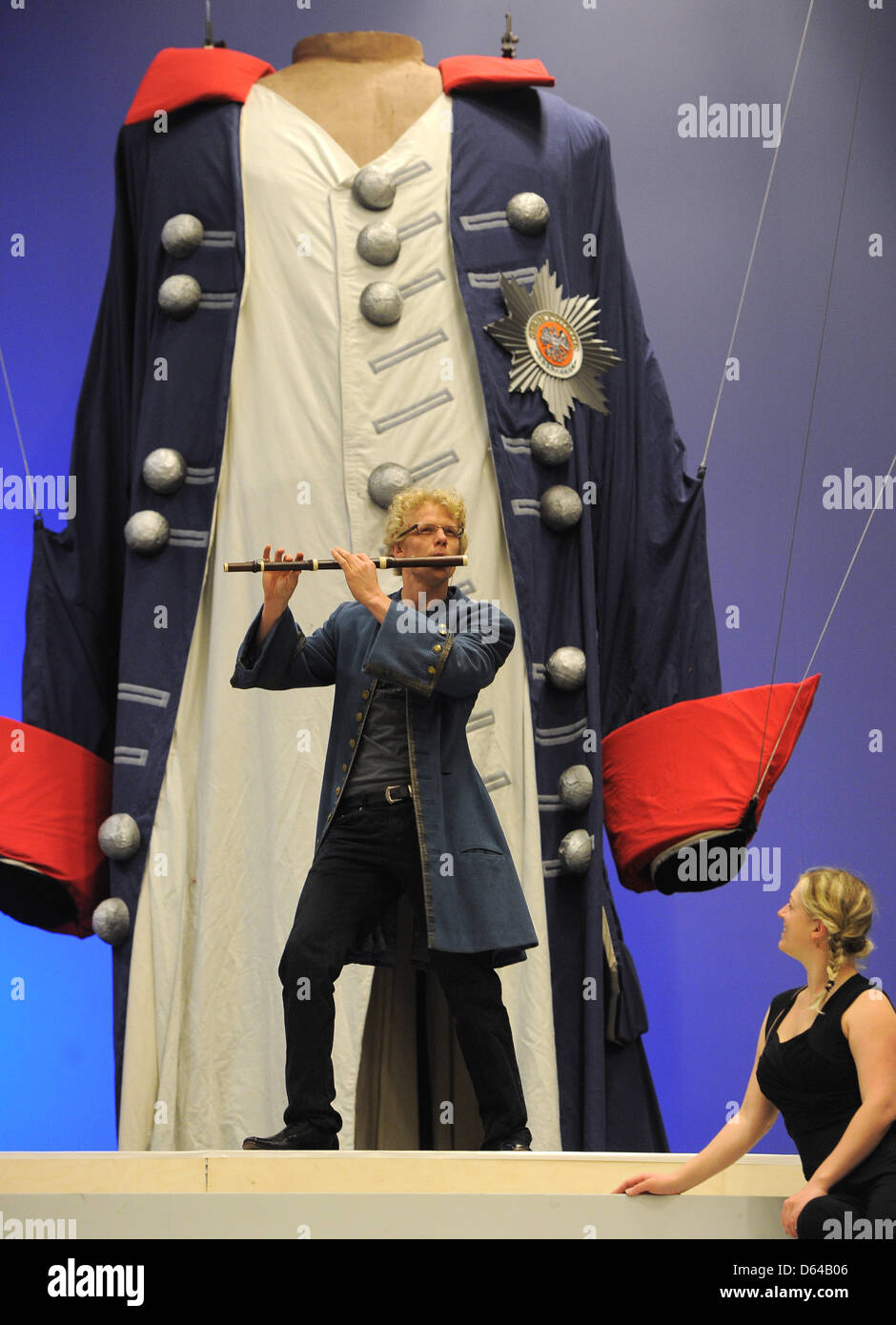 Actor Tobias Bieri plays the flute during a rehearsal for the musical