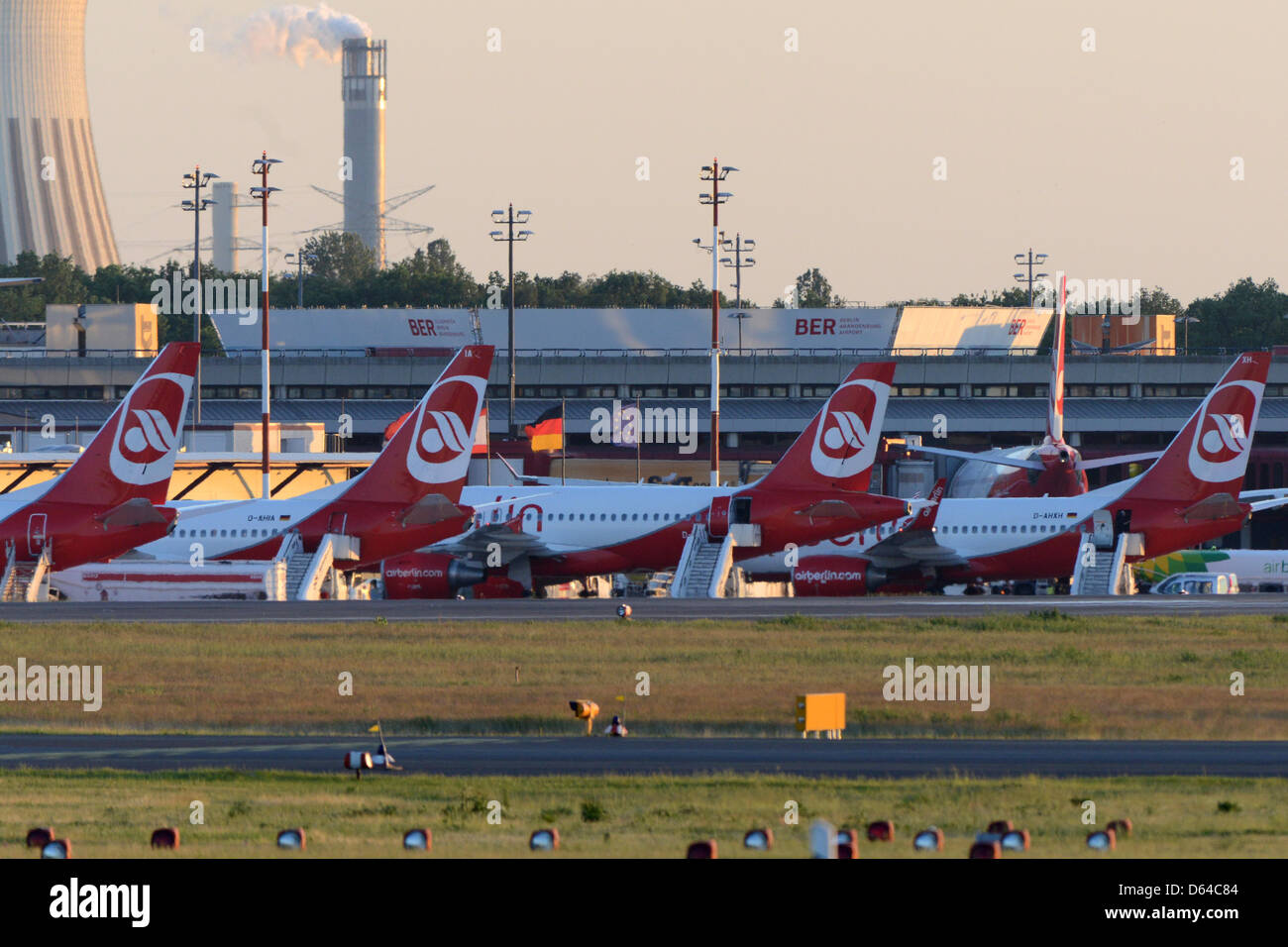 Airplanes in the evening light at Tegel Airport in Berlin, Germany, 24 May 2012. There are discussions about admitting night flights in Tegel after the opening of the new Berlin International Airport (BER) had to be pushed back to 2013. Foto: Matthias Balk dpa/lbn Stock Photo