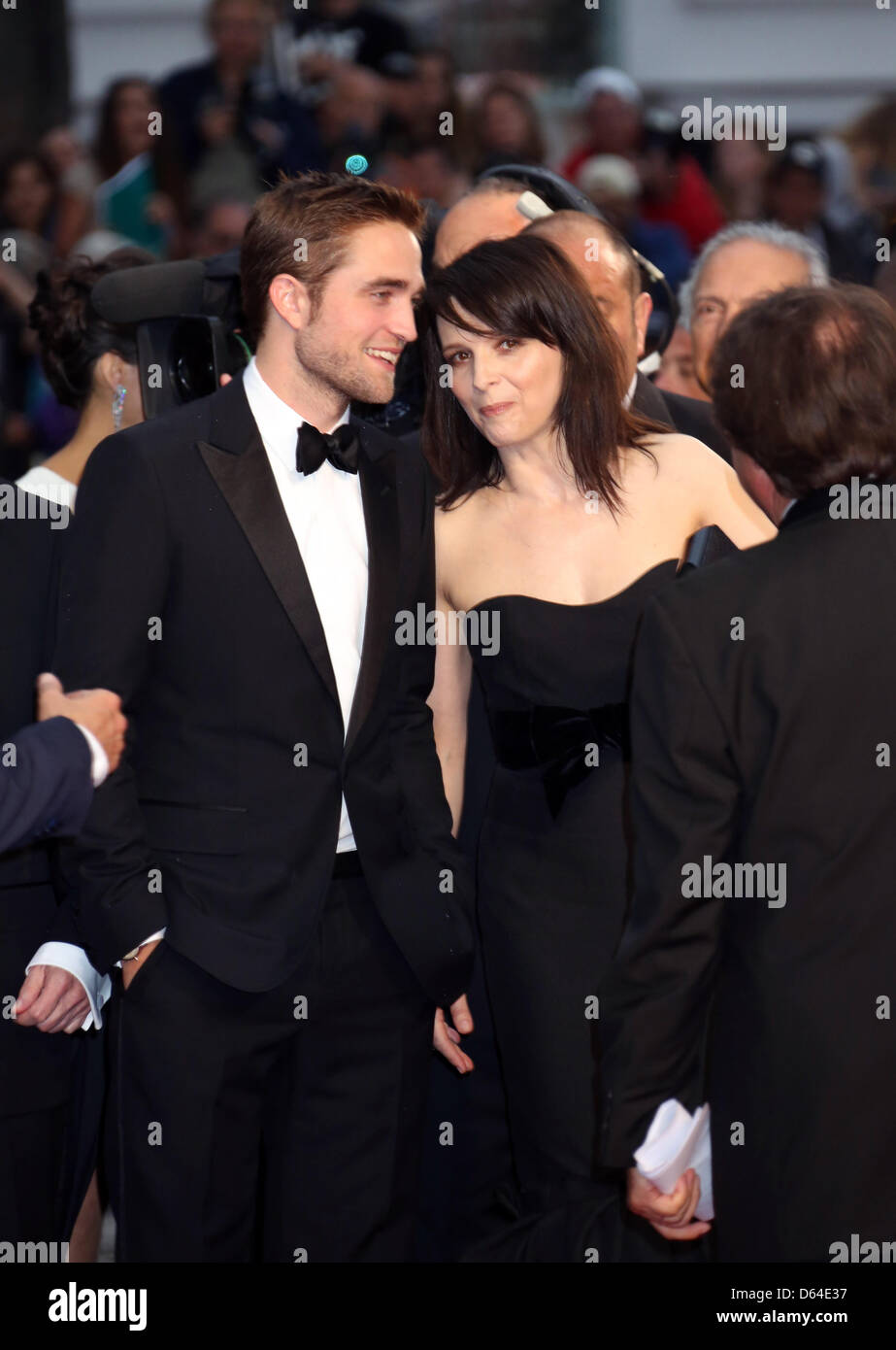 Actors Robert Pattinson and Juliette Binoche arrive at the premiere of 'Cosmopolis' during the 65th Cannes Film Festival at Palais des Festivals in Cannes, France, on 25 May 2012. Photo: Hubert Boesl Stock Photo