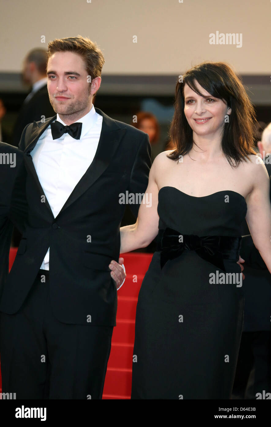 Actors Robert Pattinson and Juliette Binoche arrive at the premiere of 'Cosmopolis' during the 65th Cannes Film Festival at Palais des Festivals in Cannes, France, on 25 May 2012. Photo: Hubert Boesl Stock Photo