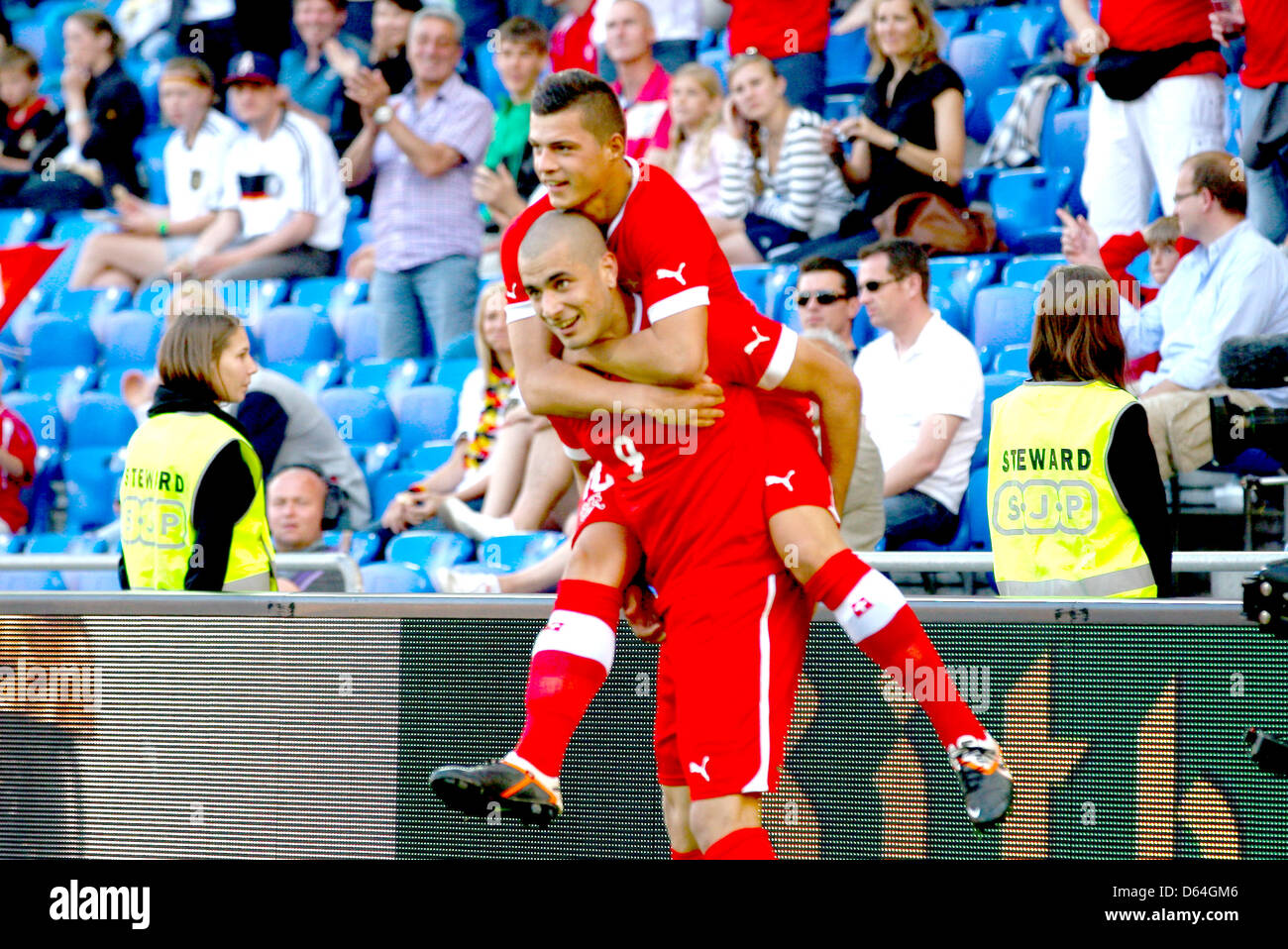 Goalscorer Eren Derdiyok (front) and Granit Xhaka (back) of the Swiss national soccer team cheer after the 3-1 goal during the soccer match between Germany and Switzerland at St Jakob Park in Basel, Switzerland, 26 May 2012. Photo: Revierfoto Stock Photo