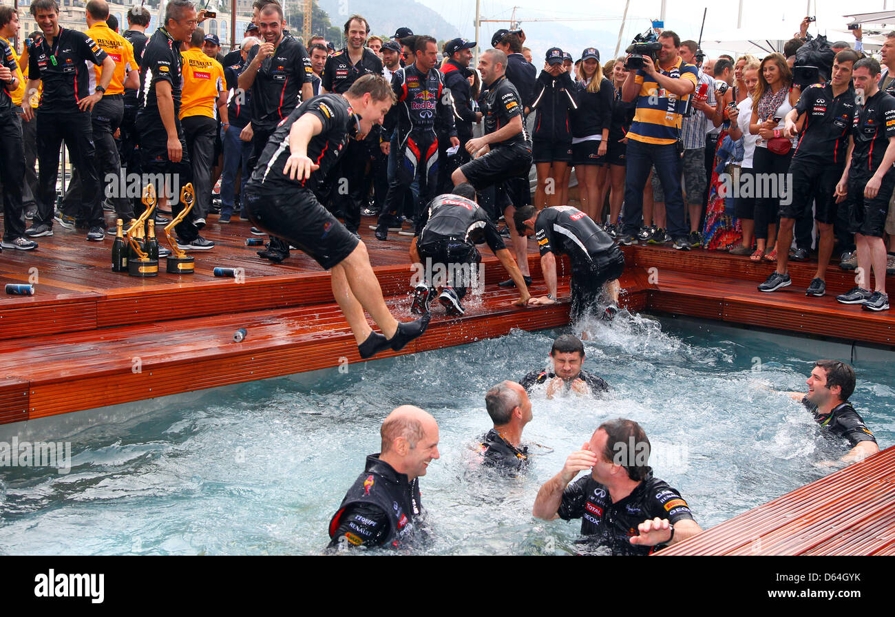 Team members from Red Bull jump into a swimming pool after winning the  Grand Prix of Monaco at the F1 race track of Monte Carlo circuit, in  Monaco, 27 May 2012. Photo: