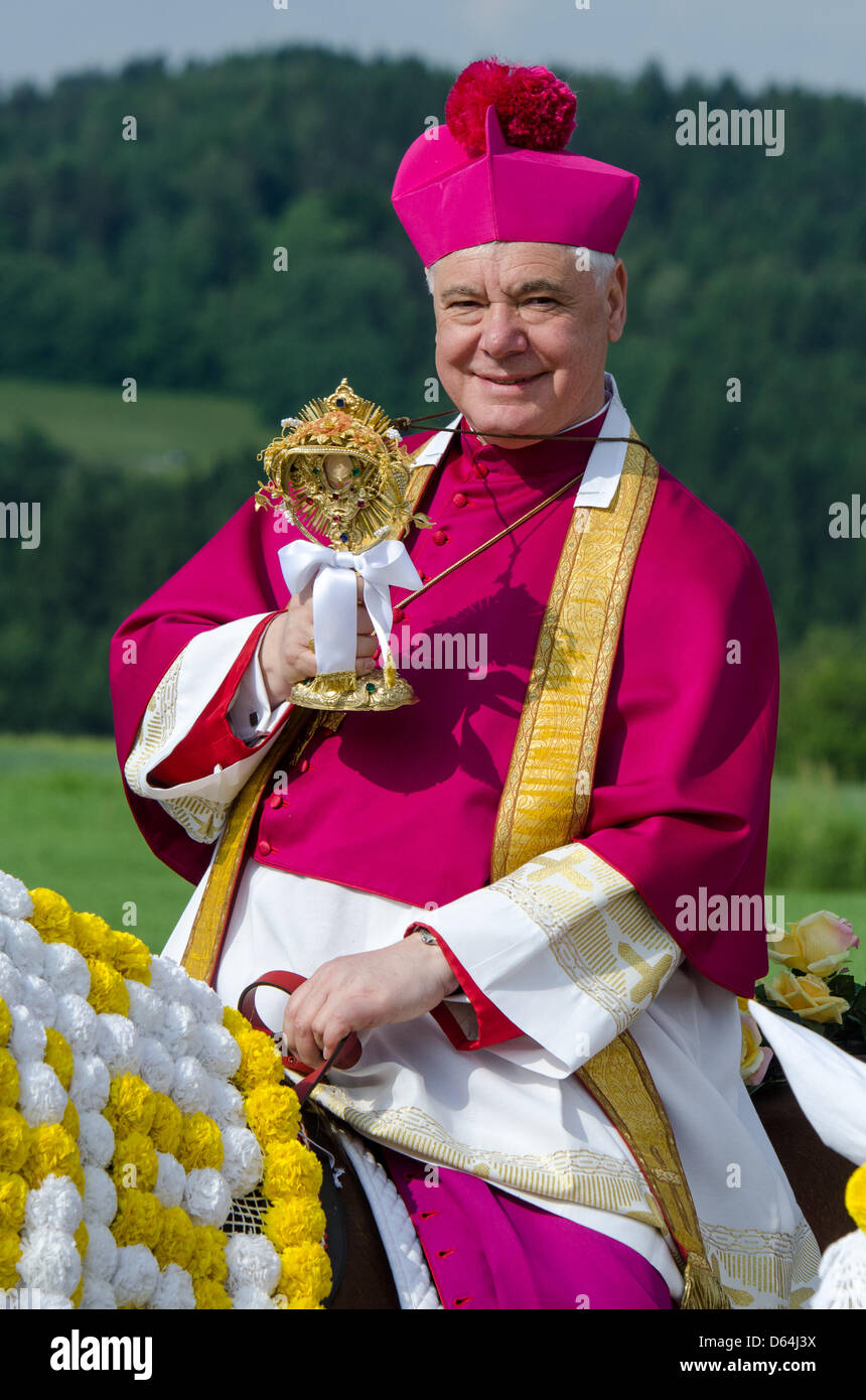 Regensburg Bishop Gerhard Ludwig Mueller attends the jubilee Pentecost ride near Bad Koetzting, Germany, 28 May 2012. For 600 years the Koetzting Pentecost ride has been held with some 900 equestrians riding to the Saint-Nicolas church in Steinbuehl. Women are not allowed to take part in the traditional procession. Photo: ARMIN WEIGEL Stock Photo