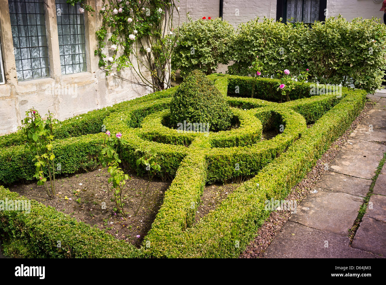 Small front garden with neat geometrical box-edged parterre Stock Photo