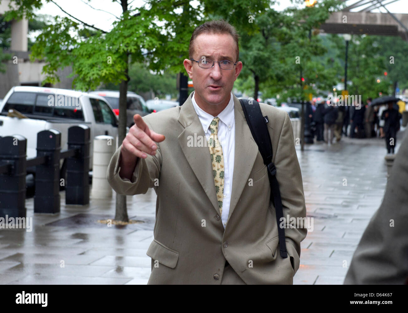 Brian McNamee speaks with an unidentified person as he departs U.S