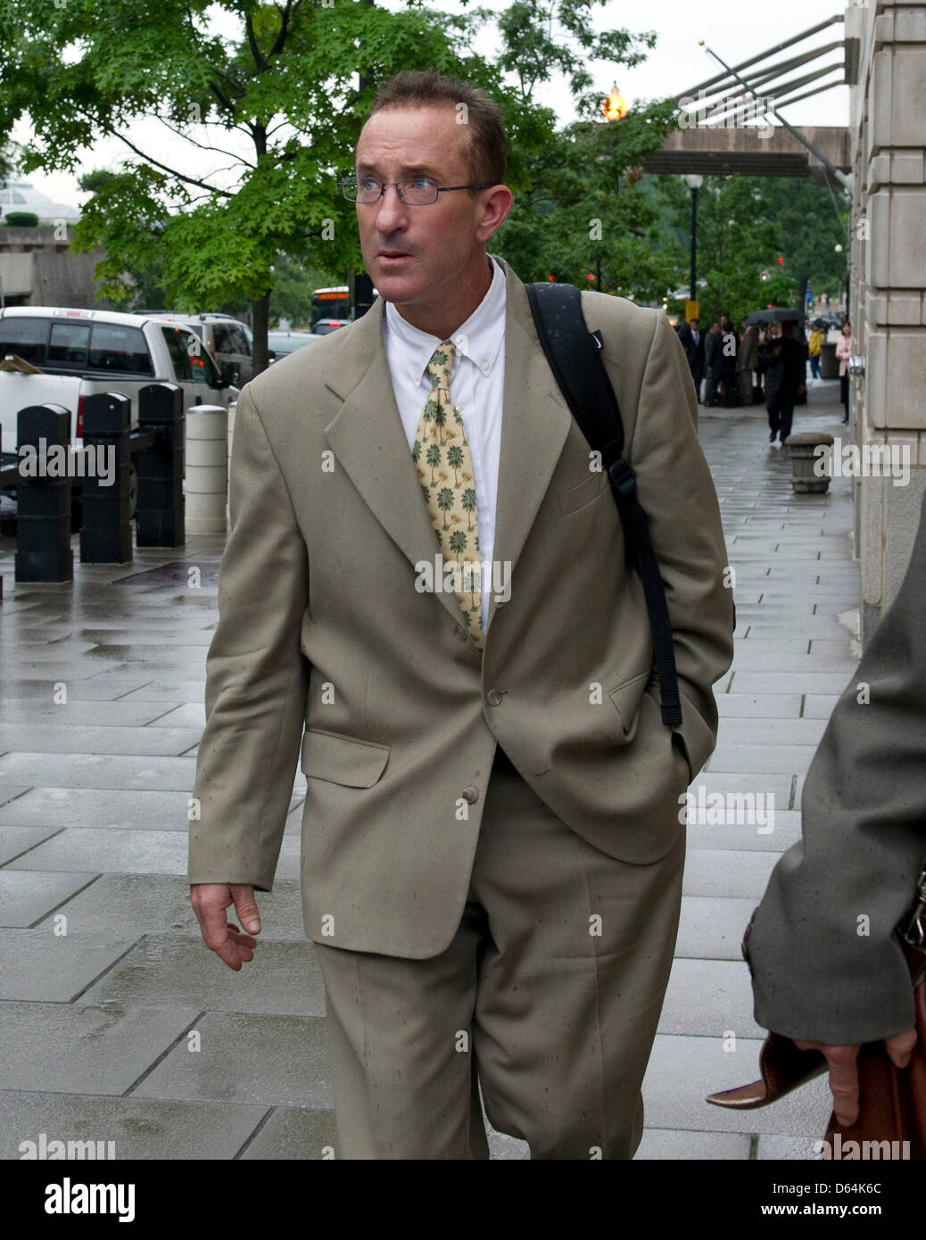 Brian McNamee speaks with an unidentified person as he departs U.S