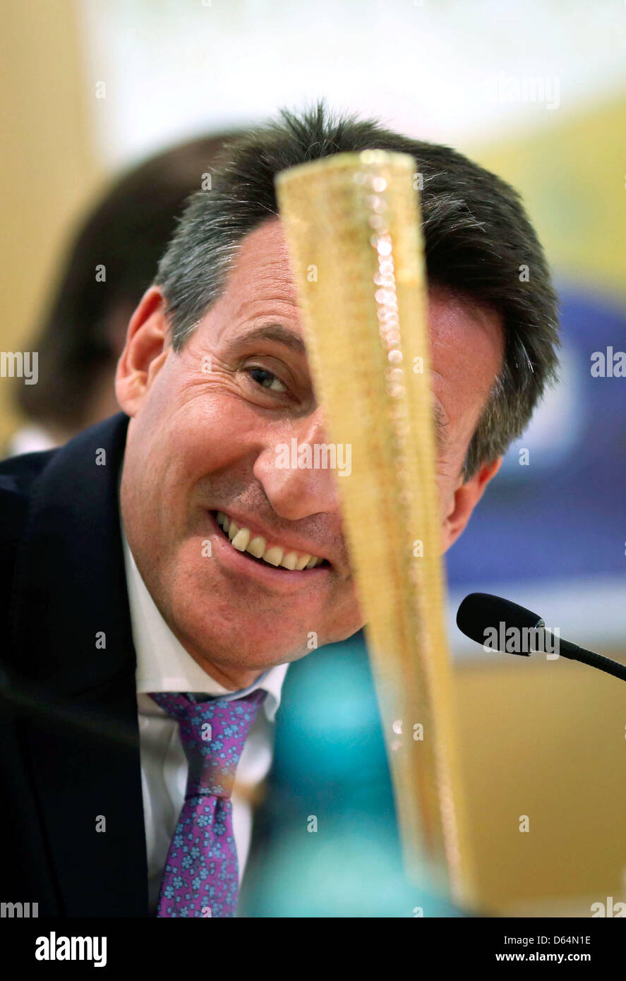 Chairman of the London Organising Committee for the Olympic Games 2012 in London Lord Sebastian Coe sits next to a replica of the Olympic torch at a press conference in Frankfurt Main, Germany, 31 May 2012. The DOSB announced the first 85 nominations for the German olympic team the same day. Photo: Frank Rumpenhorst Stock Photo