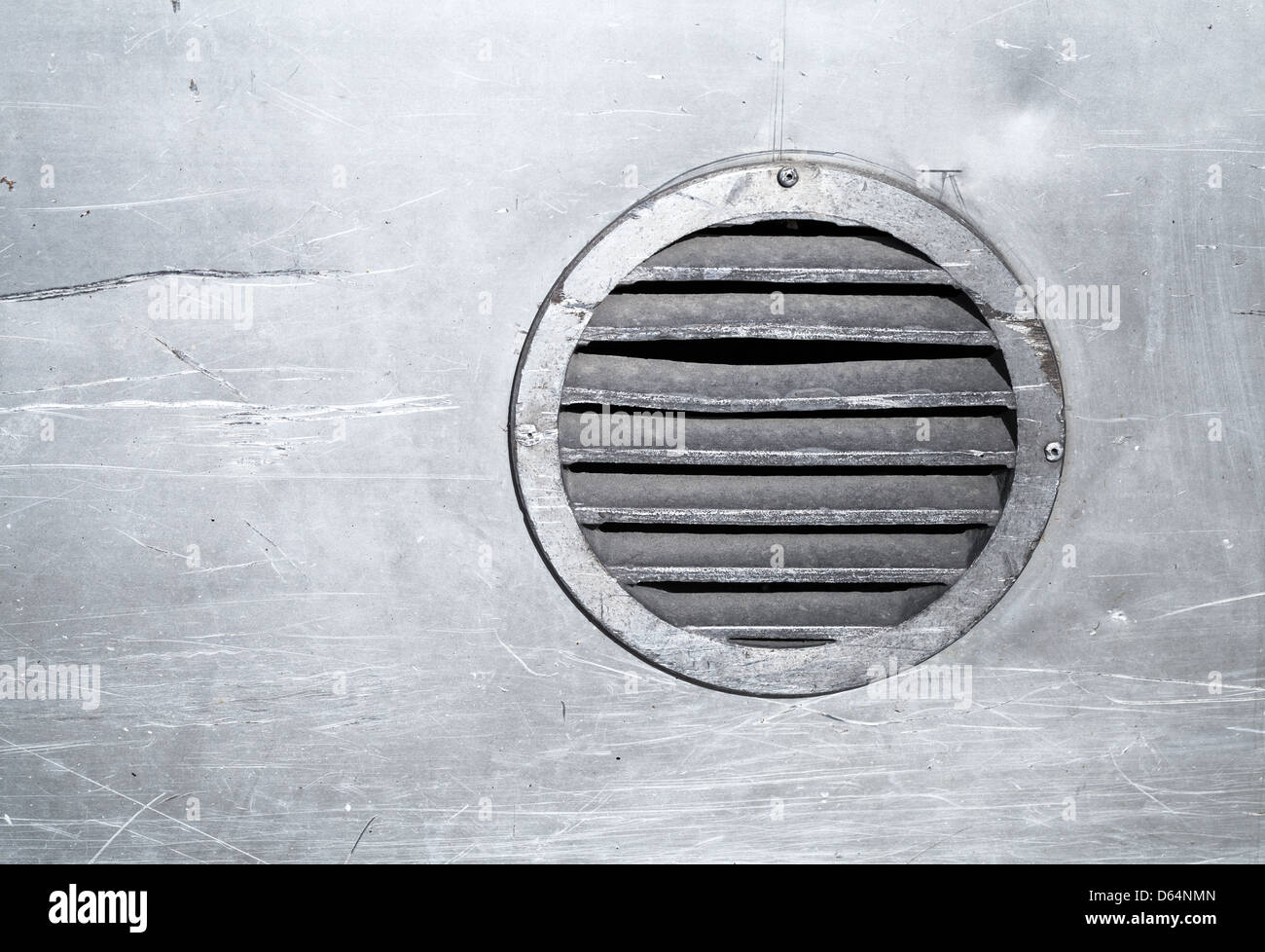 Background texture of metal wall with round ventilation element Stock Photo