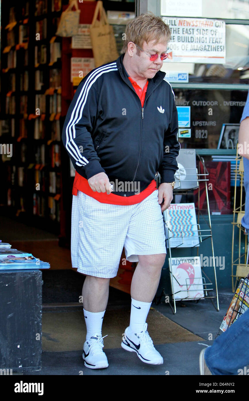 Elton John wearing an Adidas jacket as he leaves Book Soup bookstore on  Sunset Boulevard. John purchased boxes worth of books Stock Photo - Alamy