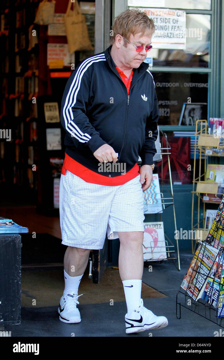 Elton John wearing an Adidas jacket as he leaves Book Soup bookstore on  Sunset Boulevard. John purchased 2 boxes worth of books Stock Photo - Alamy