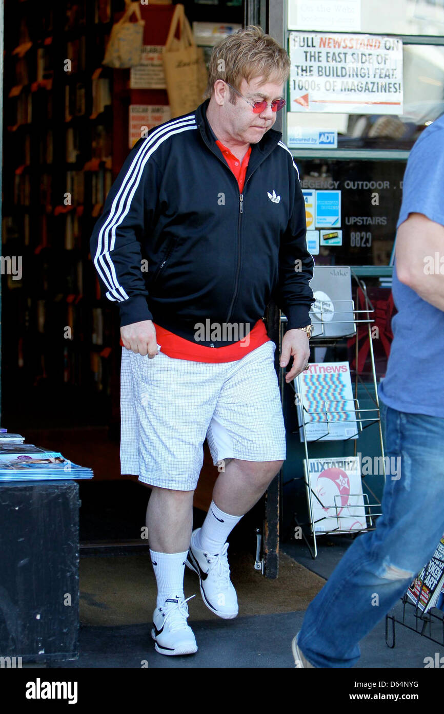 Elton John wearing an Adidas jacket as he leaves Book Soup bookstore on  Sunset Boulevard. John purchased 2 boxes worth of books Stock Photo - Alamy