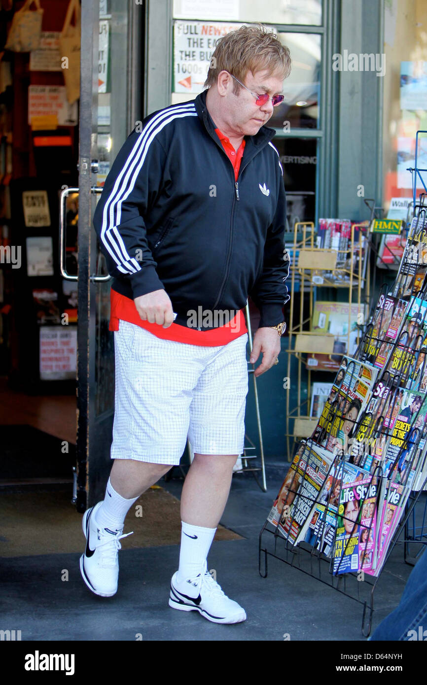 Elton John wearing an Adidas jacket as he leaves Book Soup bookstore on  Sunset Boulevard. John purchased boxes worth of books Stock Photo - Alamy