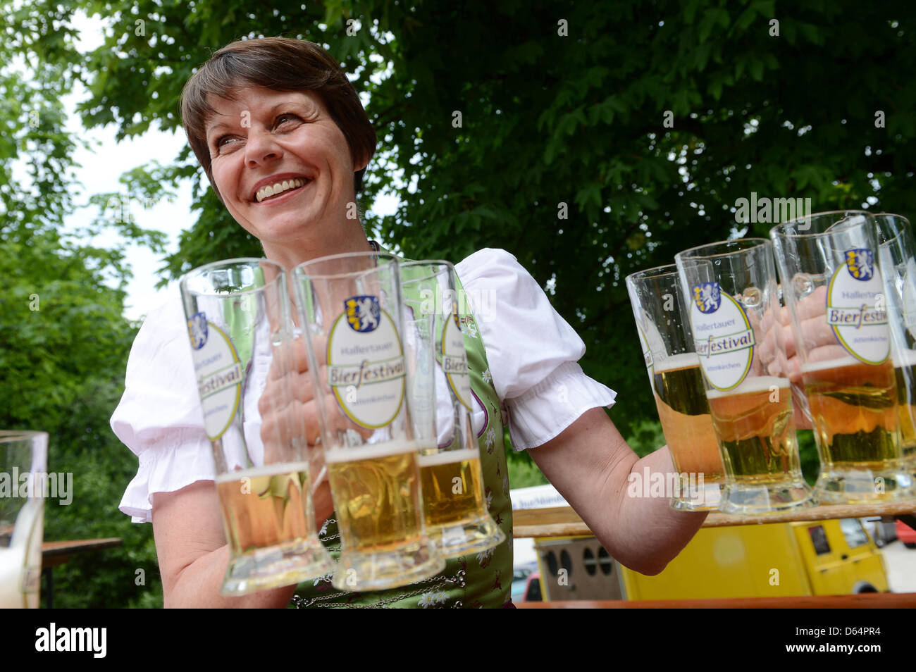 Beer sommeliere Birgit Rieber clears away glasses of beer at the ...