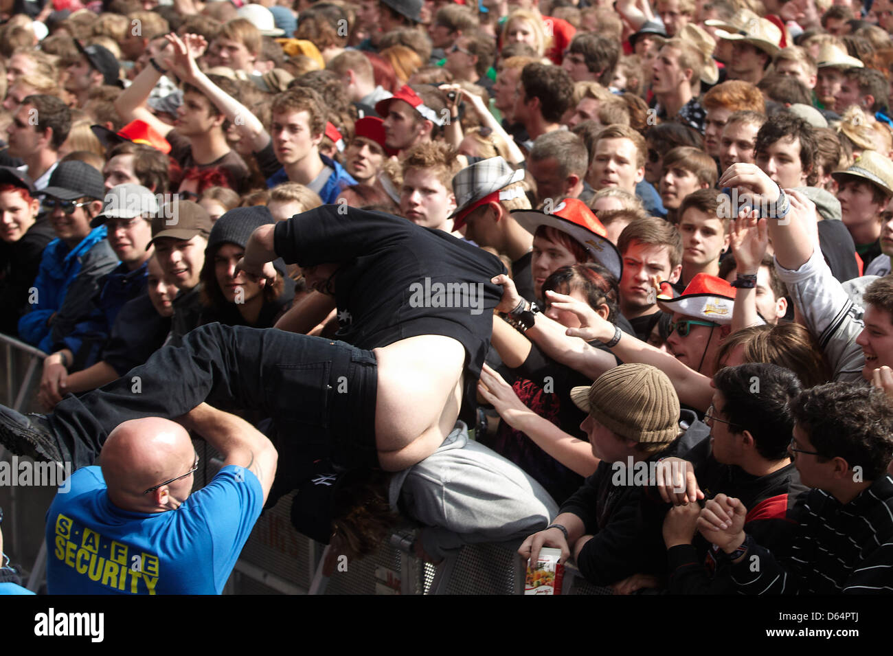 Kreet burgemeester Hoop van Security guards pull a 'Crowdsurfer' over a barrier at the Rock am Ring music festival near Nuerburg, Germany, 01 June 2012. Around 85,000 people are expected to the three-day festival with some Kreet burgemeester Hoop van Security guards pull a 'Crowdsurfer' over a barrier at the Rock am Ring music festival near Nuerburg, Germany, 01 June 2012. Around 85,000 people are expected to the three-day festival with some