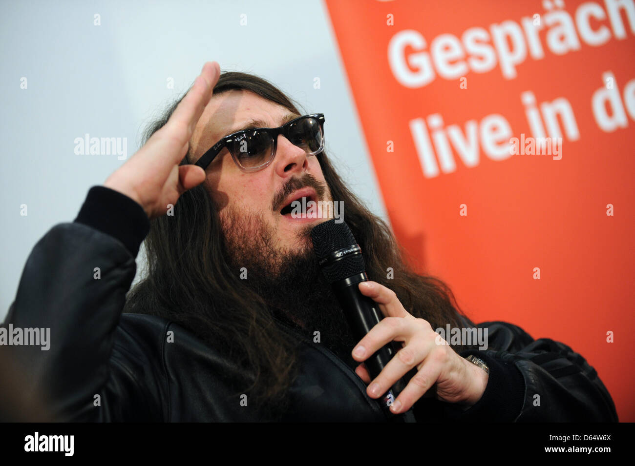 Artist Jonathan Meese speaks at an event hosted by German news magazine Der Spiegel at the university in Kassel, Germany, 04 June 2012. The excentric and controversial artist spoke on the topic of megalomania in art. Photo: UWE ZUCCHI Stock Photo