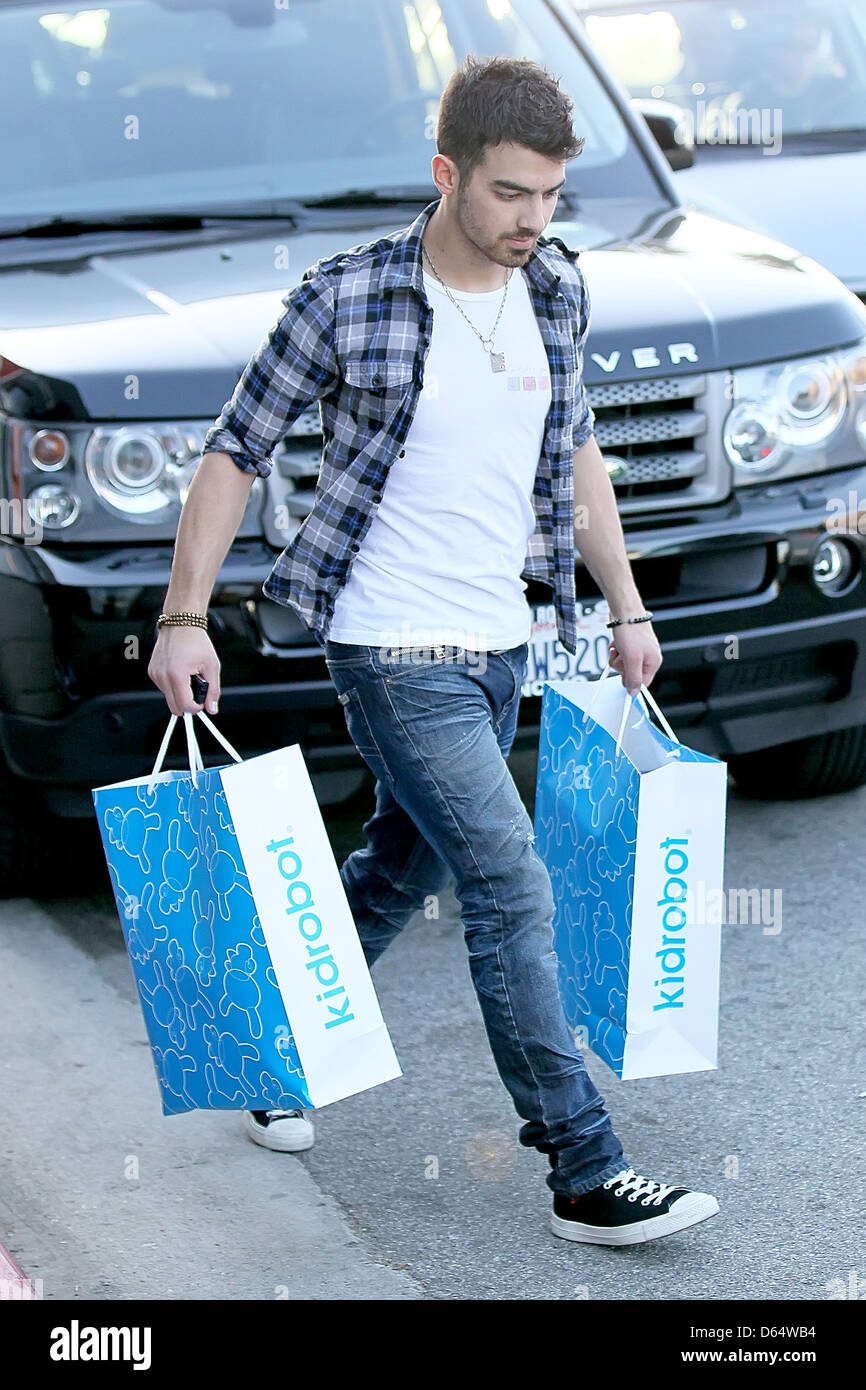 Joe Jonas leaving Kidrobot boutique with bags after going on a shopping  spree. Jonas also made a stop at G-Star Raw Los Stock Photo - Alamy