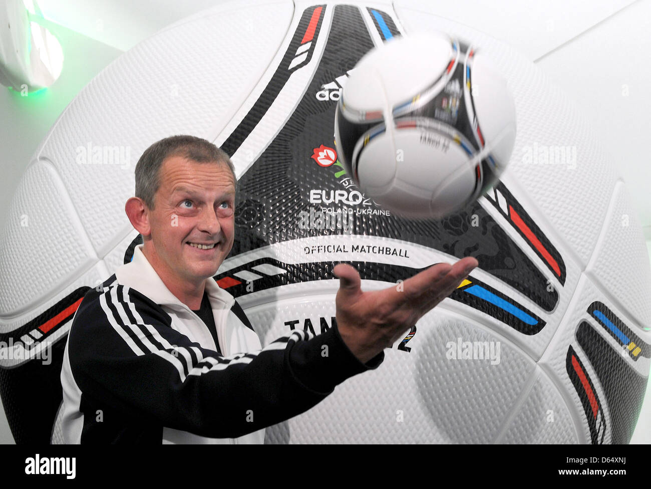 Adidas inovation designer Klaus Rolshoven presents the official Euro 2012  ball "Tango 12" during a press conference of Adidas at hotel Dwor Oliwski  in Gdansk, Poland, 6 June 2012. The UEFA EURO