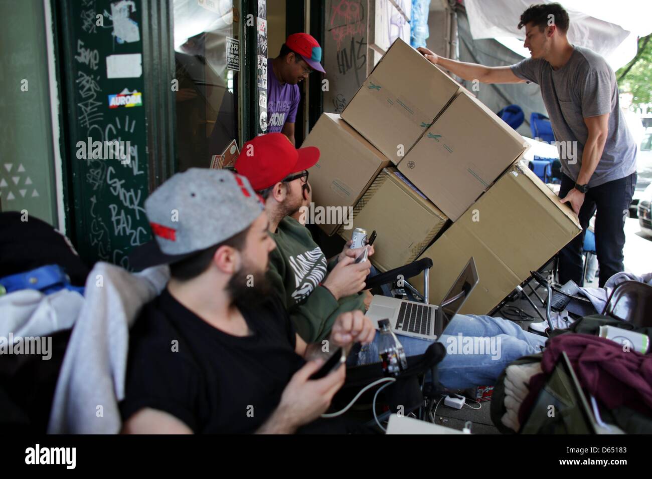 Fans camp outside of "The Good Will Out" sneaker store in Cologne, Germany,  08 June 2012. American rapper Kayne West developed the sneaker with Nike.  People have been camping outside of the