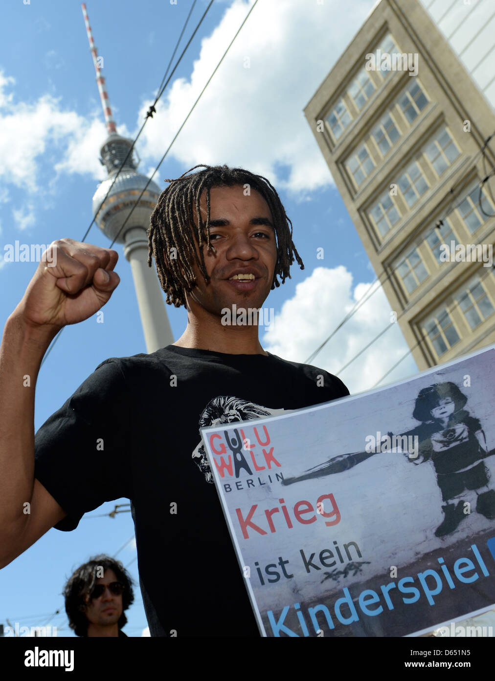Johhny Strange of Berlin band 'Culcha Gandela' attends the worldwide 'Guluwalk' under the motto 'War is no Child's Play' in Berlin, Germany, 09 June 2012. The Humanist Association Germany (HVD) organized the protest to raise awareness for the situation of children around the world who fall victim to slavery and violence or are recruited as child soliders in conflicts. Photo: MATTHI Stock Photo