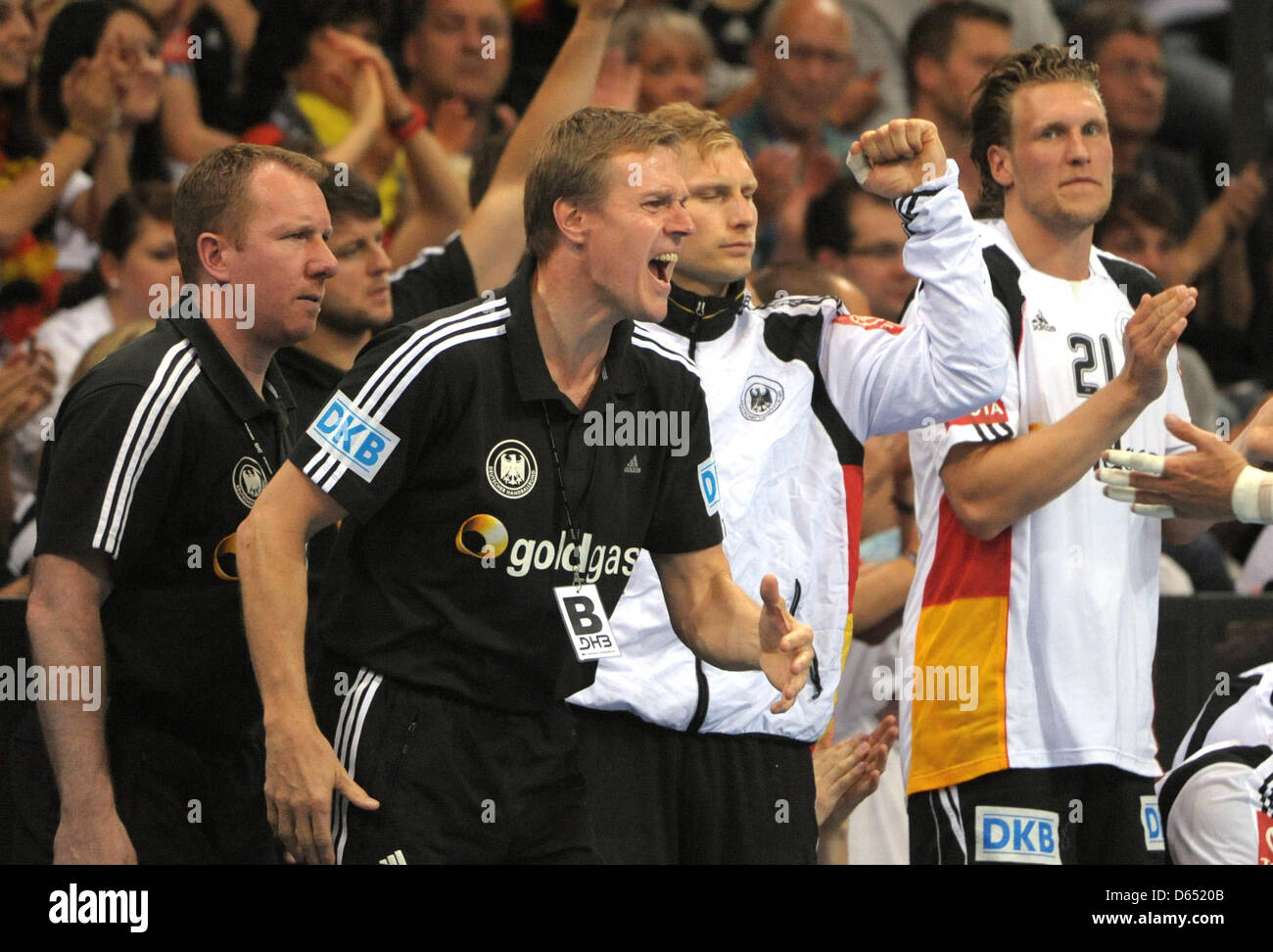 Germany's assistant coach Frank Carstens (L-R), national coach Martin Heuberger and players Steffen Weinhold and Lars Kaufmann celebrate a goal during the handball world championship qualification match between Germany and Bosnia and Herzegovina at Porsche Arena in Stuttgart, Germany, 09 June 2012. Germany won the match 36-24. Photo: MARIJAN MURAT Stock Photo