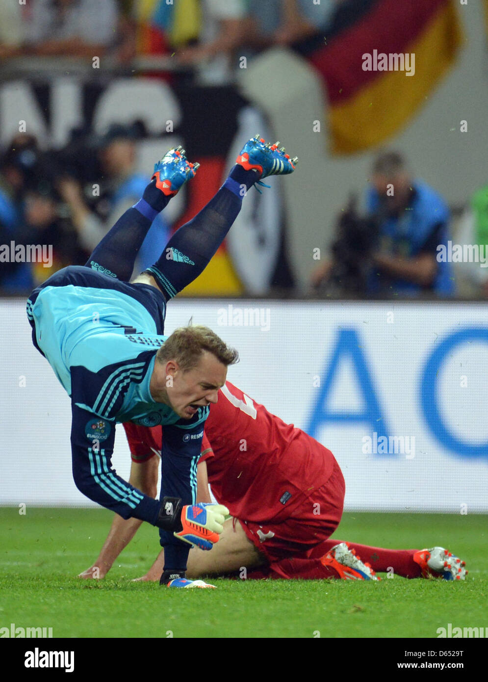 Germany's Manuel Neuer (top) and Portugal's Helder Postiga vie for the ball during UEFA EURO 2012 group B soccer match Germany vs Portugal at Arena Lviv in Lviv, the Ukraine, 09 June 2012. Photo: Thomas Eisenhuth dpa (Please refer to chapters 7 and 8 of http://dpaq.de/Ziovh for UEFA Euro 2012 Terms & Conditions) Stock Photo