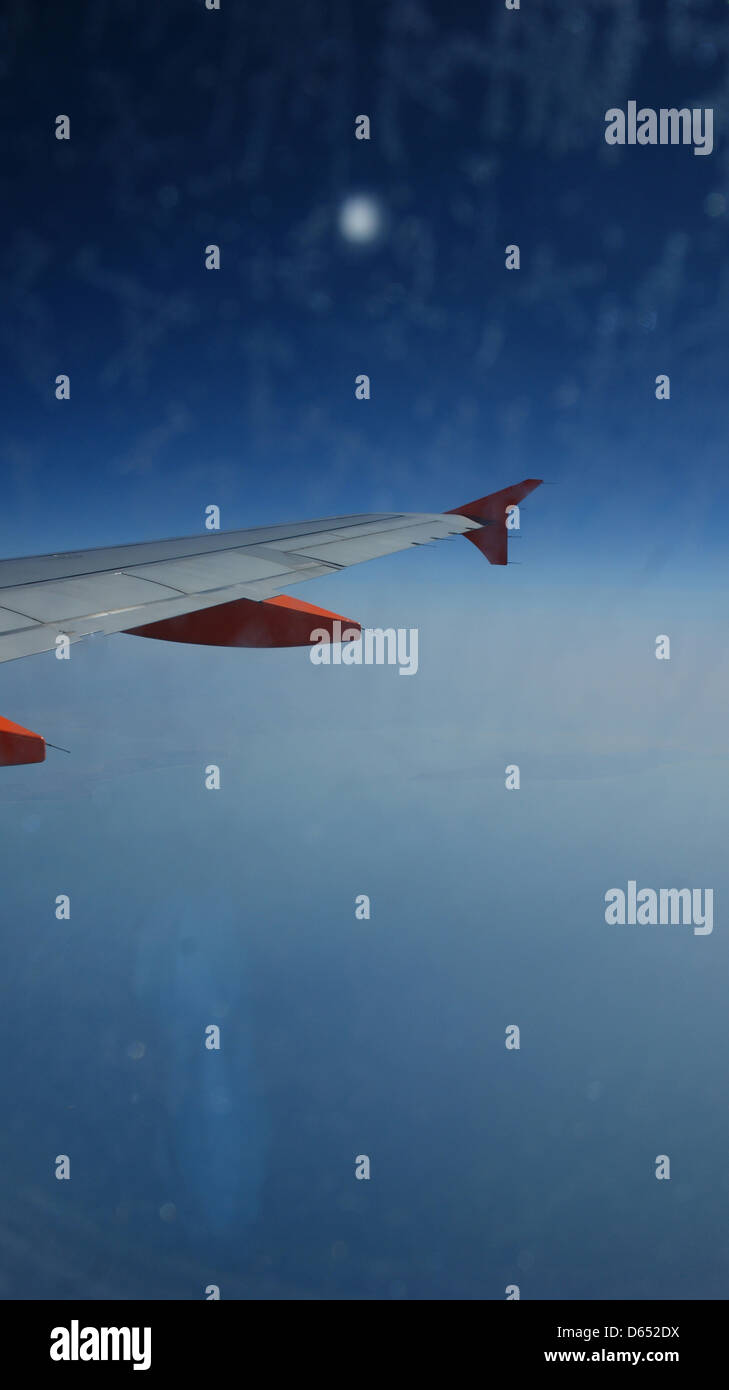 plane wing flaps sky atmosphere night day sky blue Stock Photo