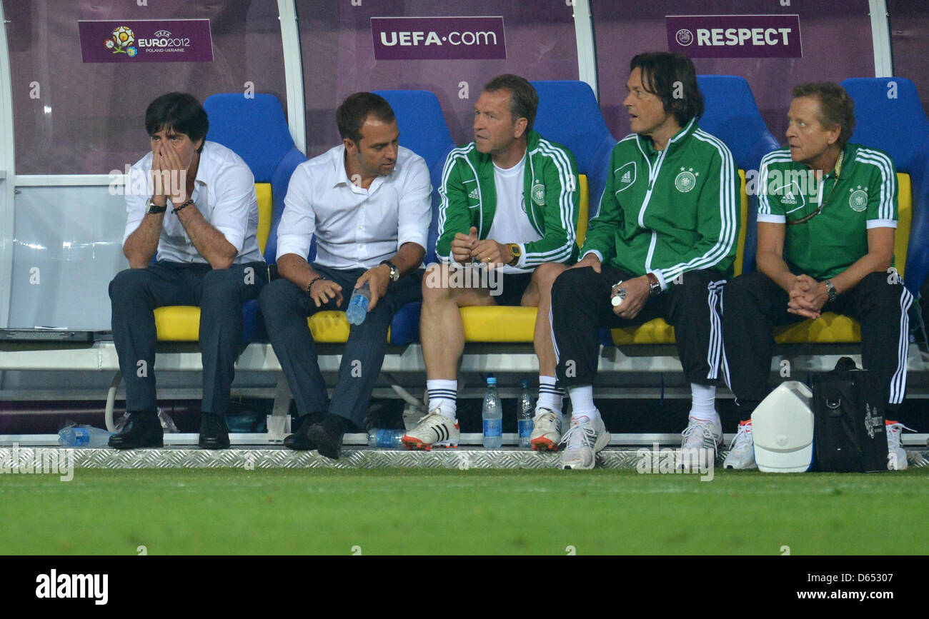 Germany's head coach Joachim Loew (L-R) assistant coach Hansi Flick, goalkeeping coach Andreas Koepke, team doctor Hans-Wilhelm Mueller-Wohlfahrt, physiotherapist Klaus Eder seen on the bench during UEFA EURO 2012 group B soccer match Germany vs Portugal at Arena Lviv in Lviv, the Ukraine, 09 June 2012. Photo: Thomas Eisenhuth dpa (Please refer to chapters 7 and 8 of http://dpaq.de Stock Photo