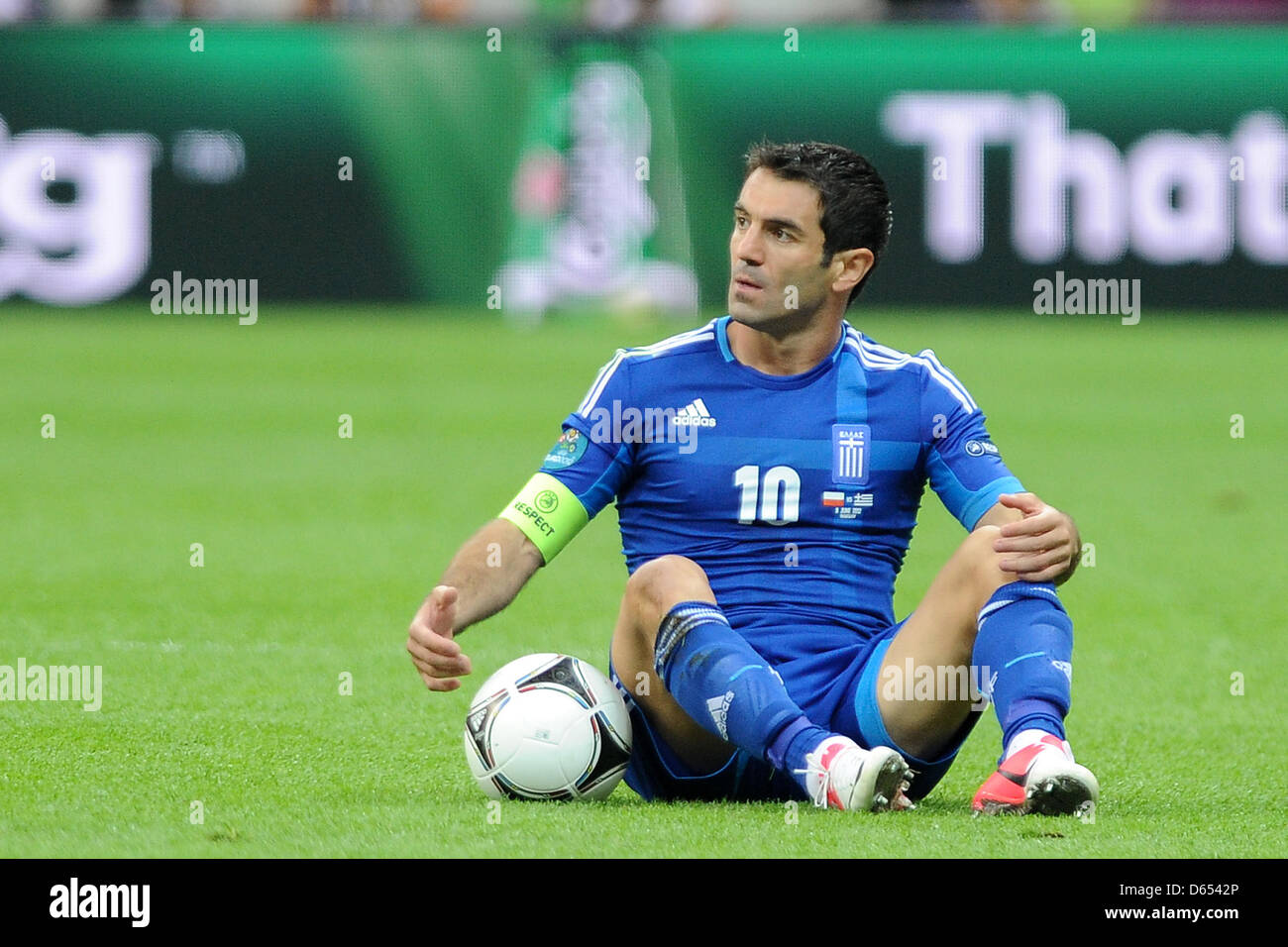 Greece's Giorgos Karagounis sits on the pitch during the UEFA Euro 2012 match between Poland and Greece at the national stadium in Warsaw, Poland, 08 June 2012. Photo: Pressfocus / Revierfoto Stock Photo