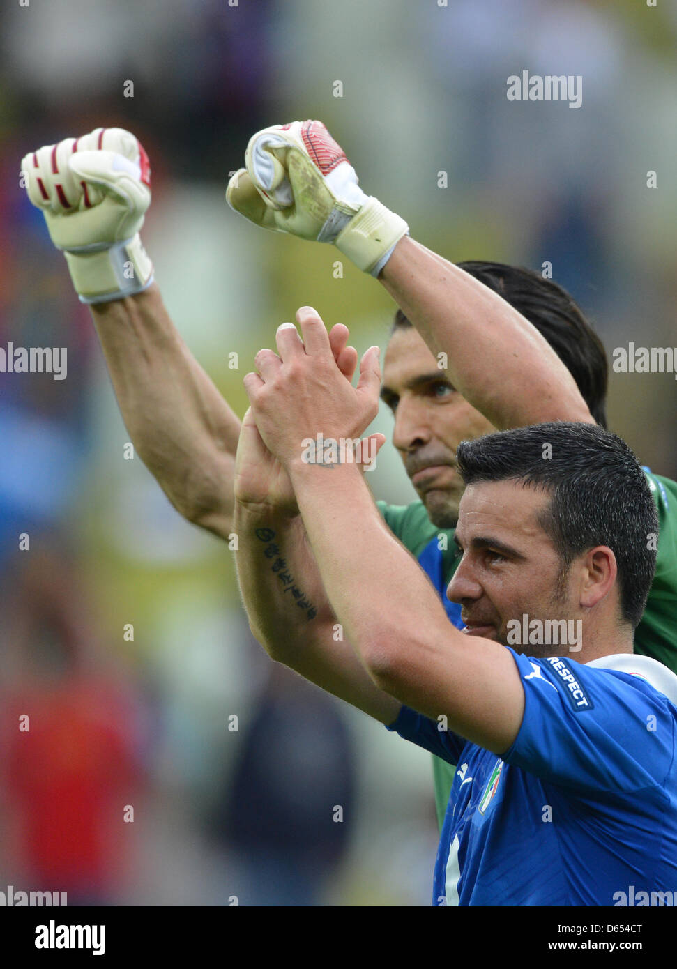 Italy's goalkeeper Gianluigi Buffon (back) and 01 scorer Antonio Di Natale celebrate after UEFA