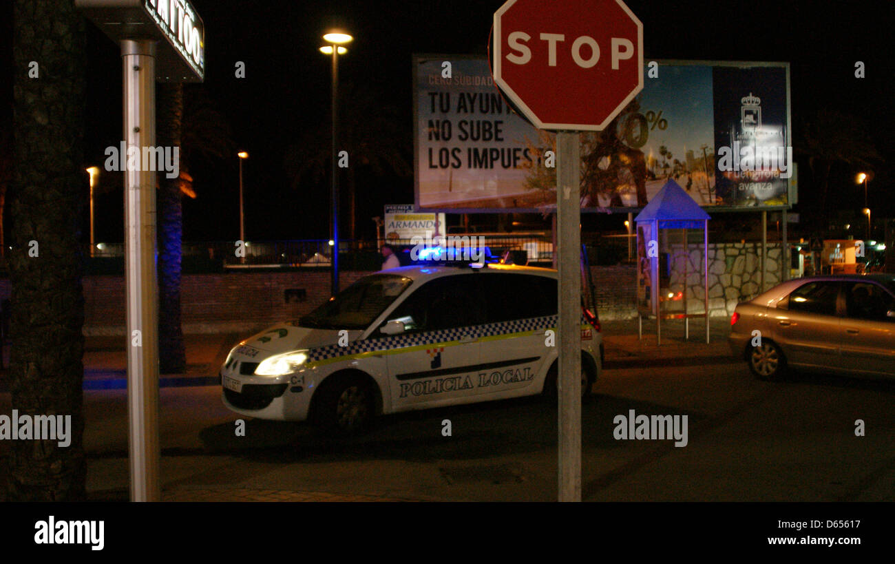 police cop car spain night stop sign blue lights flashing parking pulling over Stock Photo