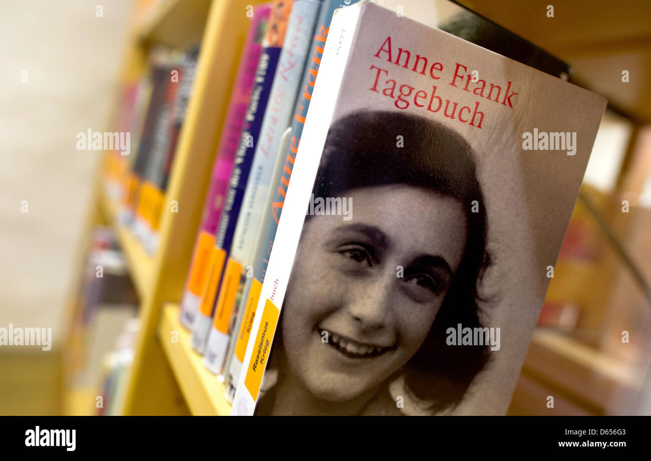 A copy of 'The Diary of Anne Frank' sits on a bookshelf in the public library of Pirna, Germany, 12 June 2012. The diary, which Anne Frank got on her 13th birthday seventy years ago, is one if the most important documents from the   Nazi Era. From 9 November to 7 December 2012, the public library of Pirna will host an exhibition dealing with Anne Frank's life. Photo: Arno Burgi Stock Photo