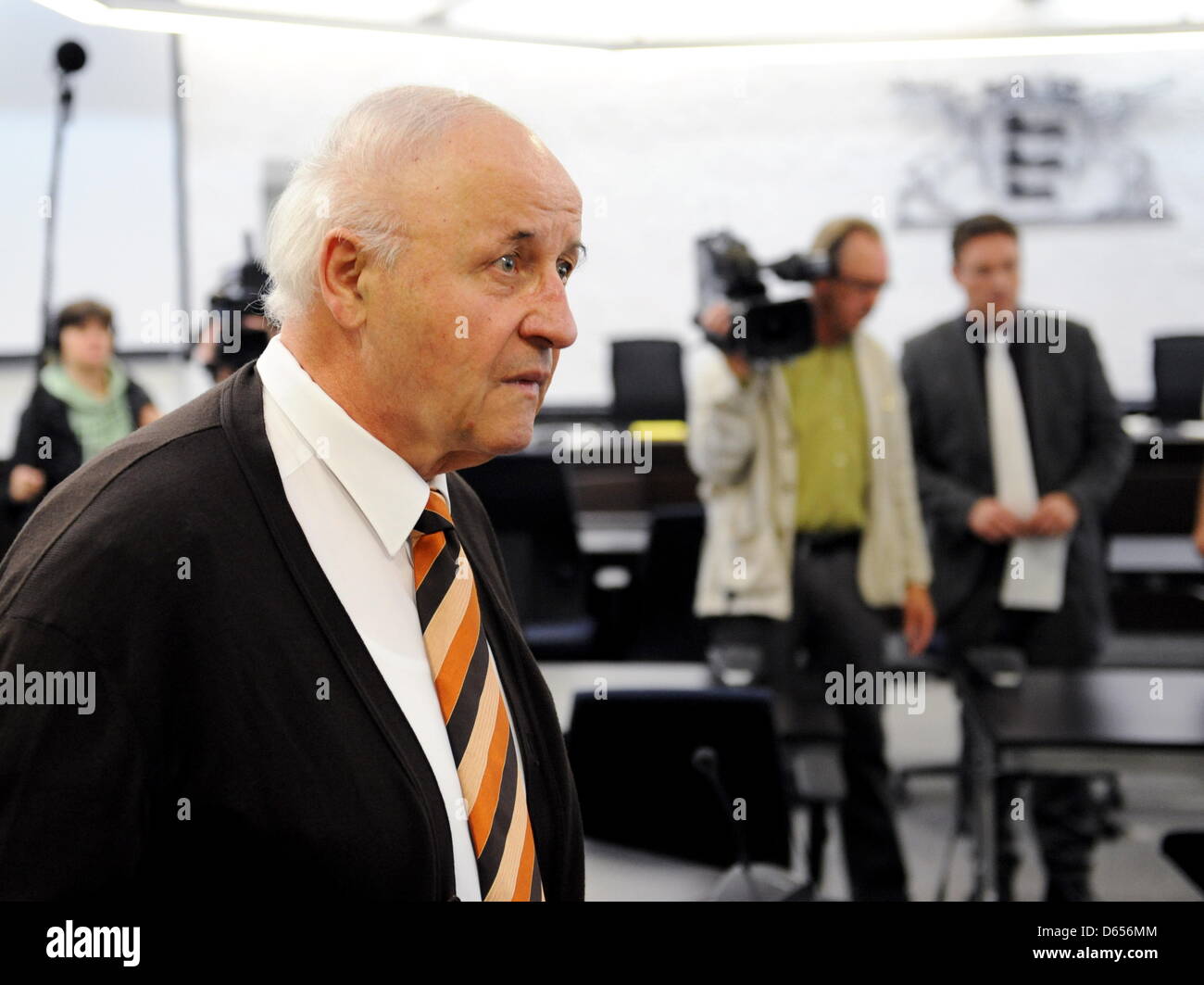Michael Buback, joint plaintiff in the trial against former RAF terrorist Becker, enters a courtroom of the Higher Regional Court in Stuttgart, Germany, 12 June 2012. The court is hearing the case on the complicity of Becker in the murder of former Attorney General Buback, the father of Michael Buback. Photo: Bernd Weissbrod Stock Photo