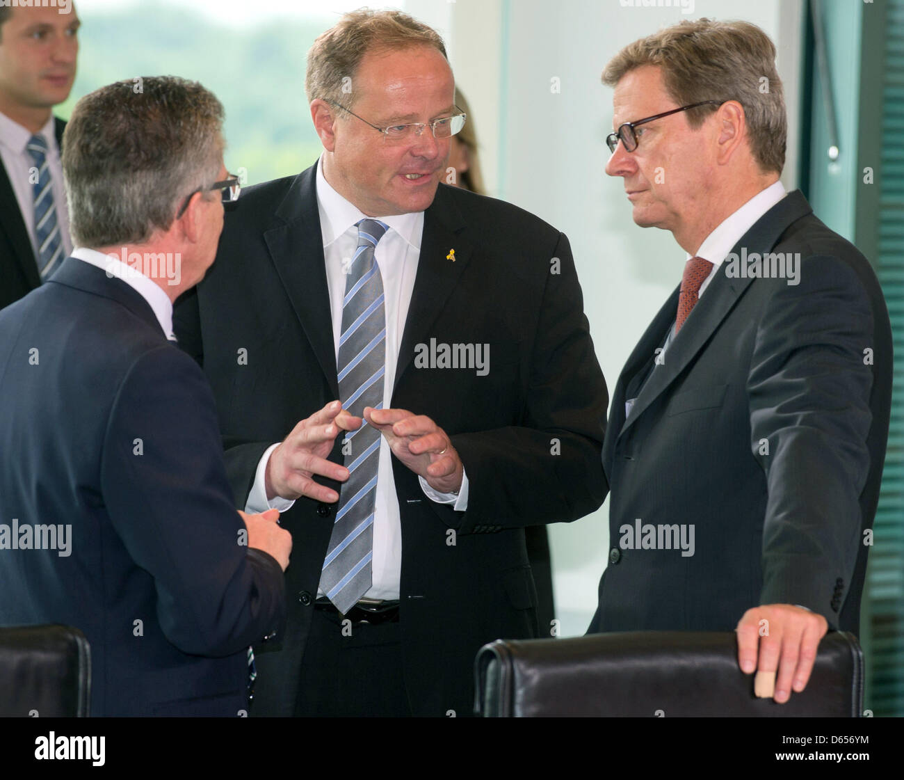 German Minister of Defence Thomas de Maiziere (CDU, L-R), German Minister of Economic Cooperation Dirk Niebel (FDP) and German Foreign Minister Guido Westerwelle (FDP) attend the cabinet meeting at the Federal Chancellery in Berlin, Germany, 13 June 2012. The meeting of ministers confered on a fund for the support of GDR institutionalized children, amongst other things. Photo: TIM  Stock Photo